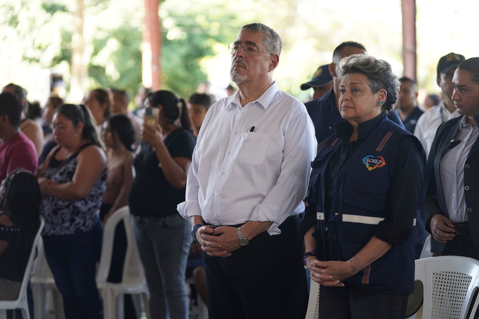 Guatemalan President Bernardo Arévalo and first lady Lucrecia Peinados, pay their final respects to the victims of a bus crash, at a funeral service in Santo Domingo Los Ocotes, Guatemala, Tuesday, Feb. 11, 2025. Dozens of passengers died after their bus plunged into a gorge and landed under a bridge on Feb. 10 on the outskirts of the Guatemalan capital. (AP Photo/Moises Castillo)