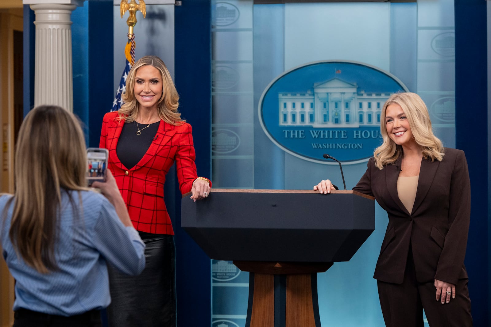 Lara Trump, left, and White House press secretary Karoline Leavitt pose for a picture in the Briefing Room of the White House, Tuesday, Feb. 18, 2025, in Washington. (AP Photo/Alex Brandon)