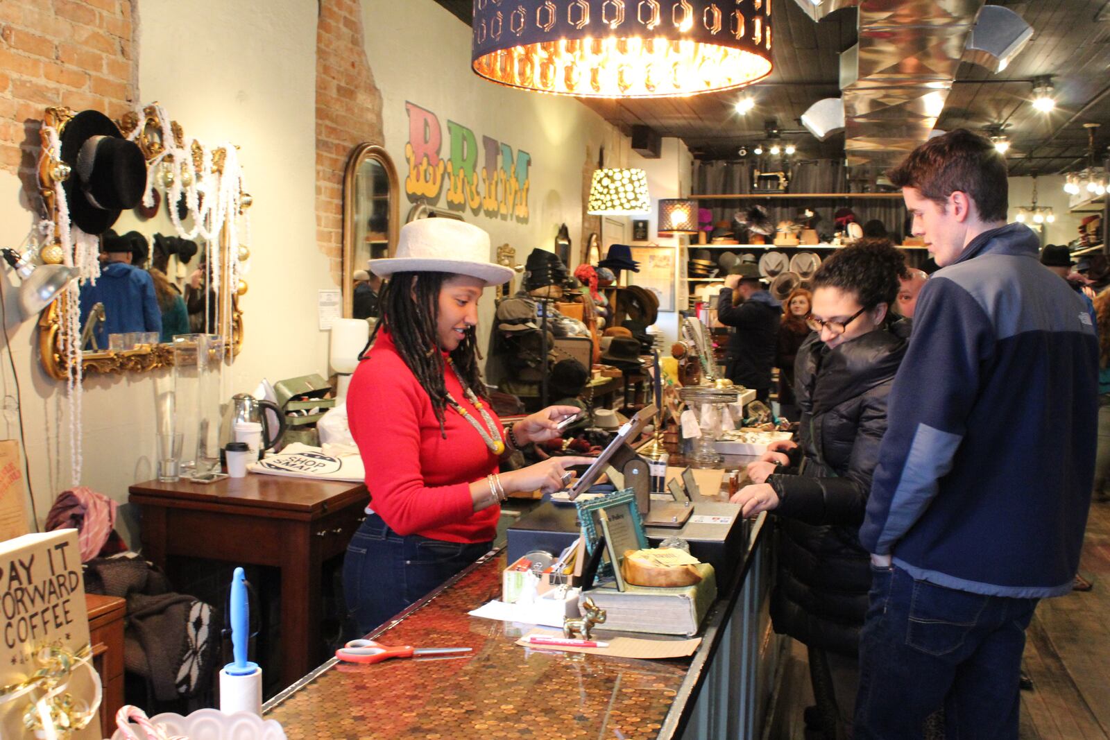 The rain didn't keep happy customers away from their local haunts for Small Business Saturday. Businesses including Brim, Clash Dayton, Heart on Fifth, Omega Music, and Baker Salvage Company had sales, coffee and treats for loyal patrons who braved the weather on Nov. 28, 2015. VIVIENNE MACHI / STAFF