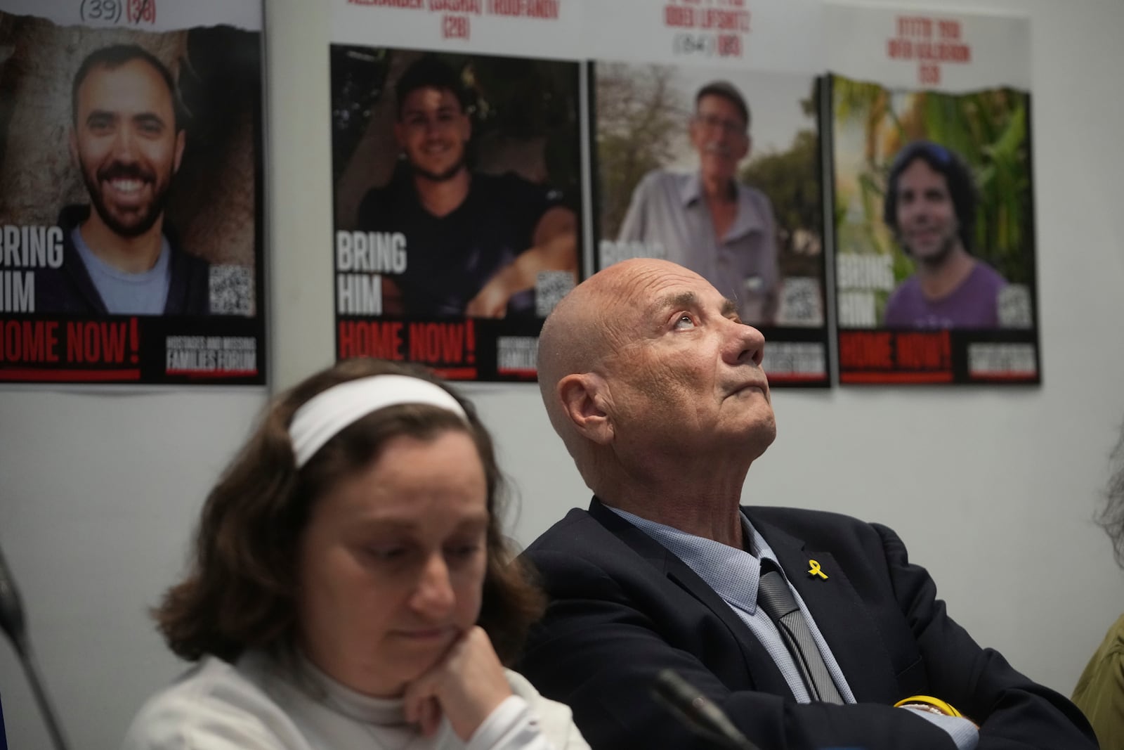 Elena Troufanov, left, and Louis Har, former Israeli hostages and relatives of some still being held by Hamas attend a press conference in Rome, Thursday, Nov. 14, 2024. (AP Photo/Alessandra Tarantino)