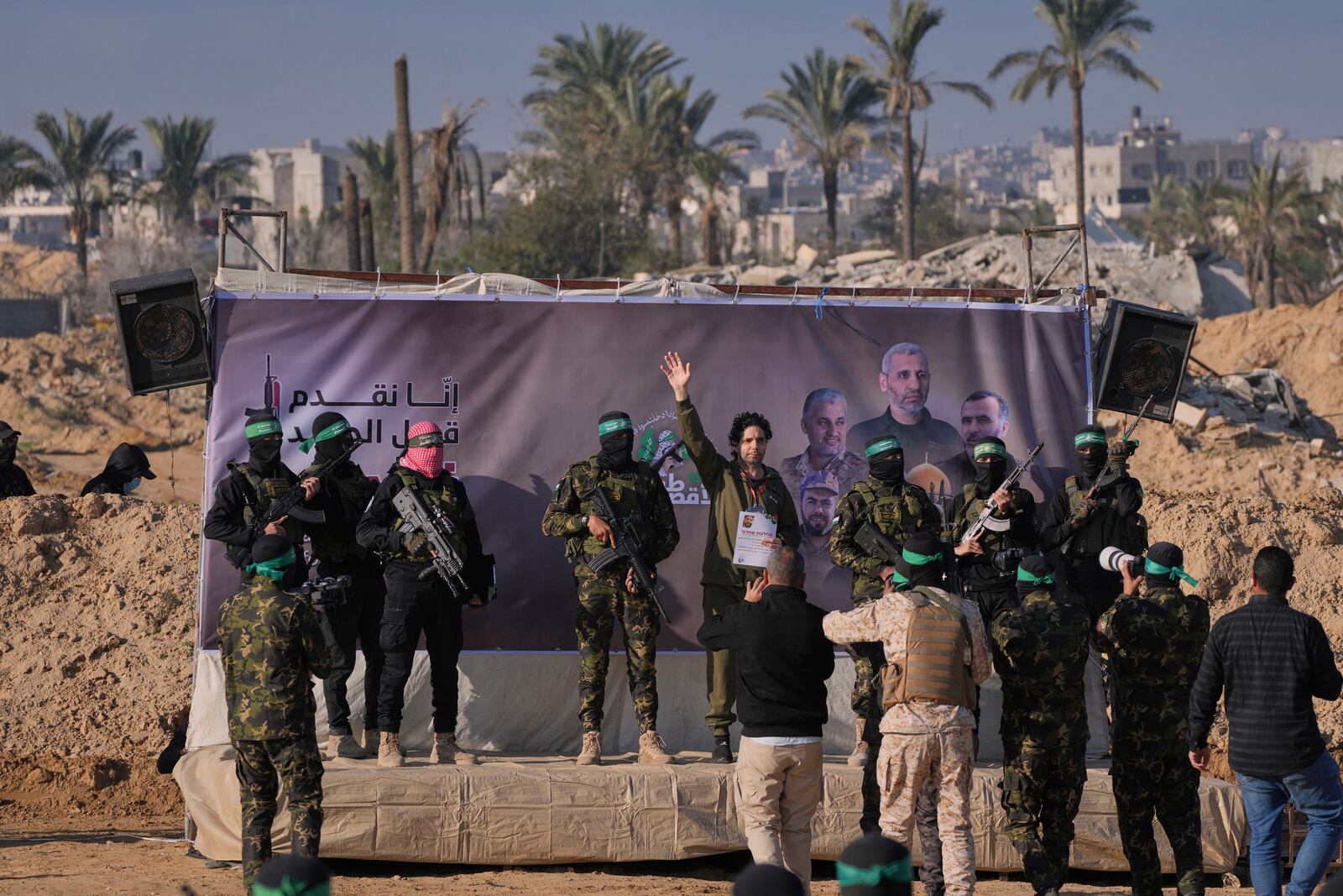 Israeli Ofer Kalderon who has been held hostage by Hamas in Gaza since October 7, 2023, waves before being handed over to the Red Cross by Hamas fighters in Khan Younis, southern Gaza Strip, Saturday Feb. 1, 2025. Photo/Abdel Kareem)