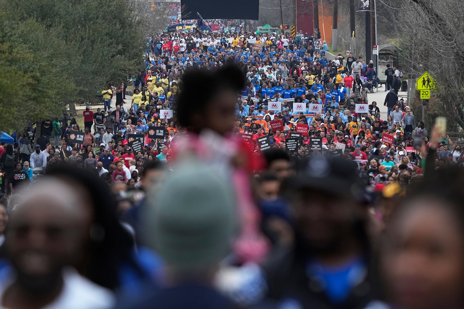 FILE - Thousands of walkers take part in a march honoring Martin Luther King Jr. on MLK Day in San Antonio, Jan. 16, 2023. (AP Photo/Eric Gay, File)