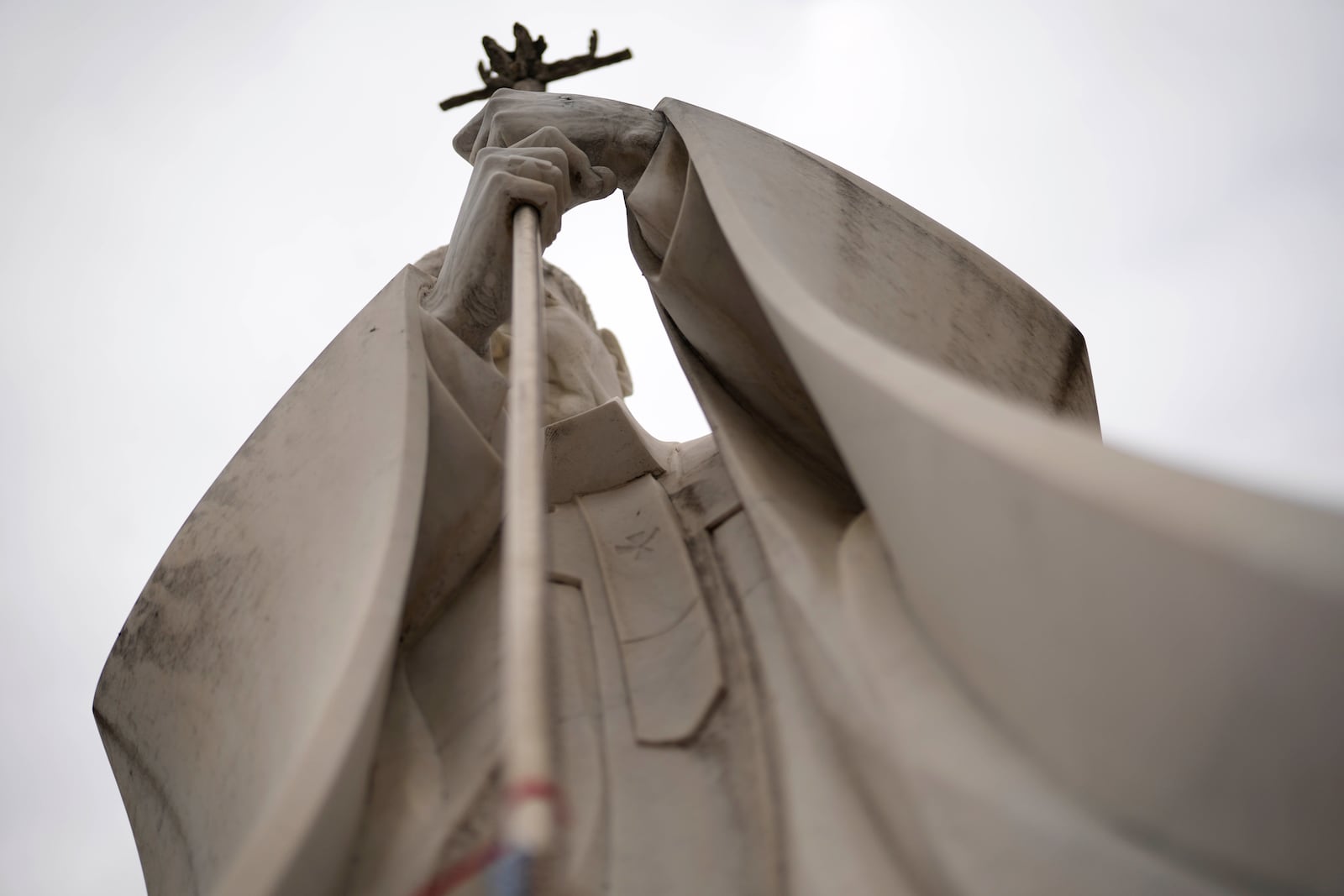 A marble statue of late Pope John Paul II is pictured outside the Agostino Gemelli Polyclinic in Rome, Monday, Feb. 17, 2025, where Pope Francis was hospitalized Friday, Feb. 14, after a weeklong bout of bronchitis worsened and is receiving drug therapy for a respiratory tract infection. (AP Photo/Gregorio Borgia)