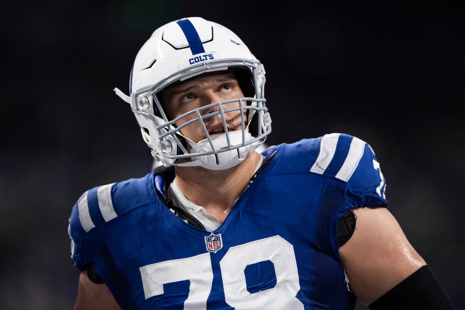 FILE - Indianapolis Colts center Ryan Kelly watches a replay during the team's NFL football game against the Jacksonville Jaguars on Nov. 14, 2021, in Indianapolis.  (AP Photo/Zach Bolinger, File)