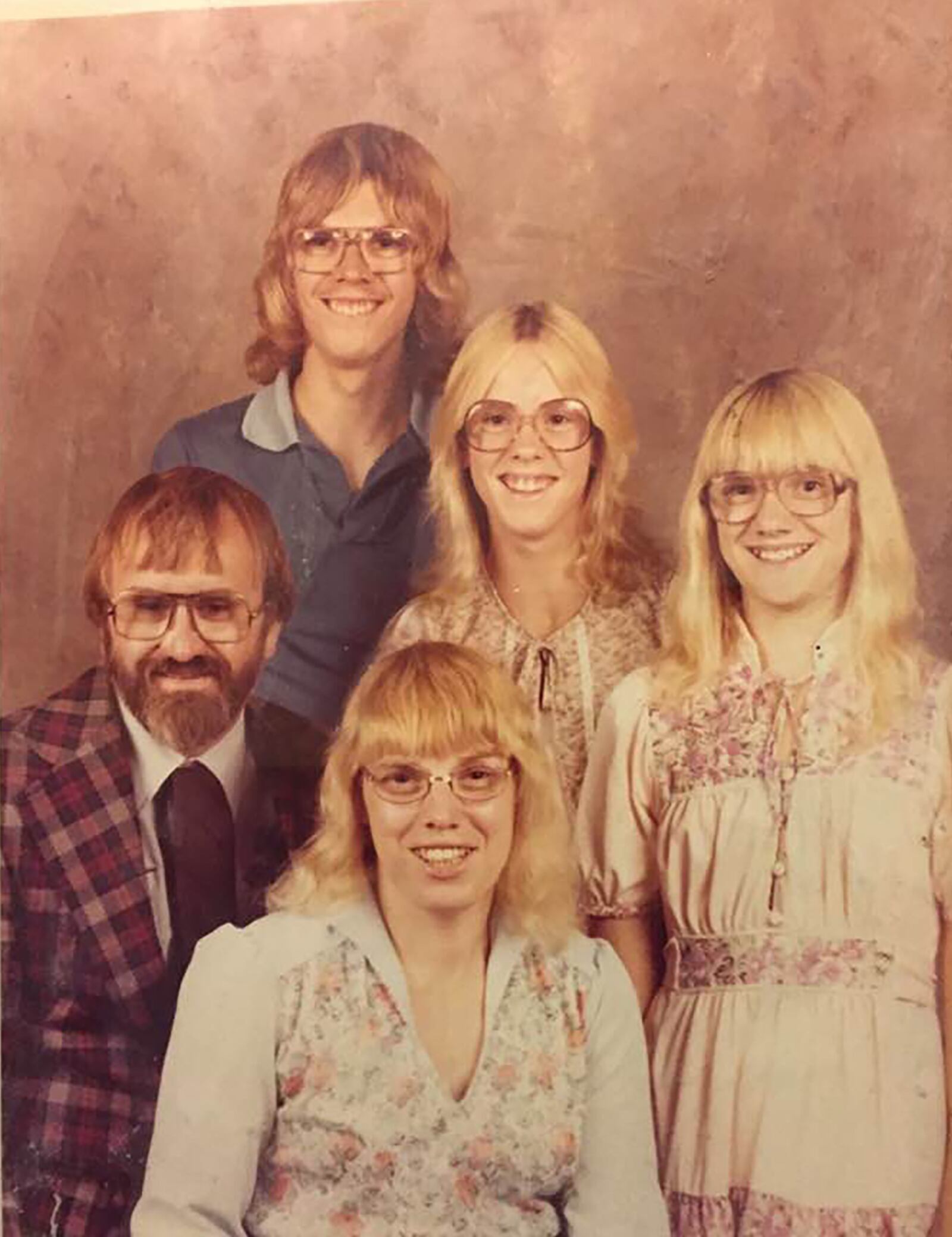 David Nugent, seated left, and his family. Wife Rosemary (front) who passed away in 2009 and standing, left to right, children David, Michelle and Carmen. After his wife passed away, Nugent revived his childhood hobby of fixing up and repairing abandoned bicycles. CONTRIBUTED