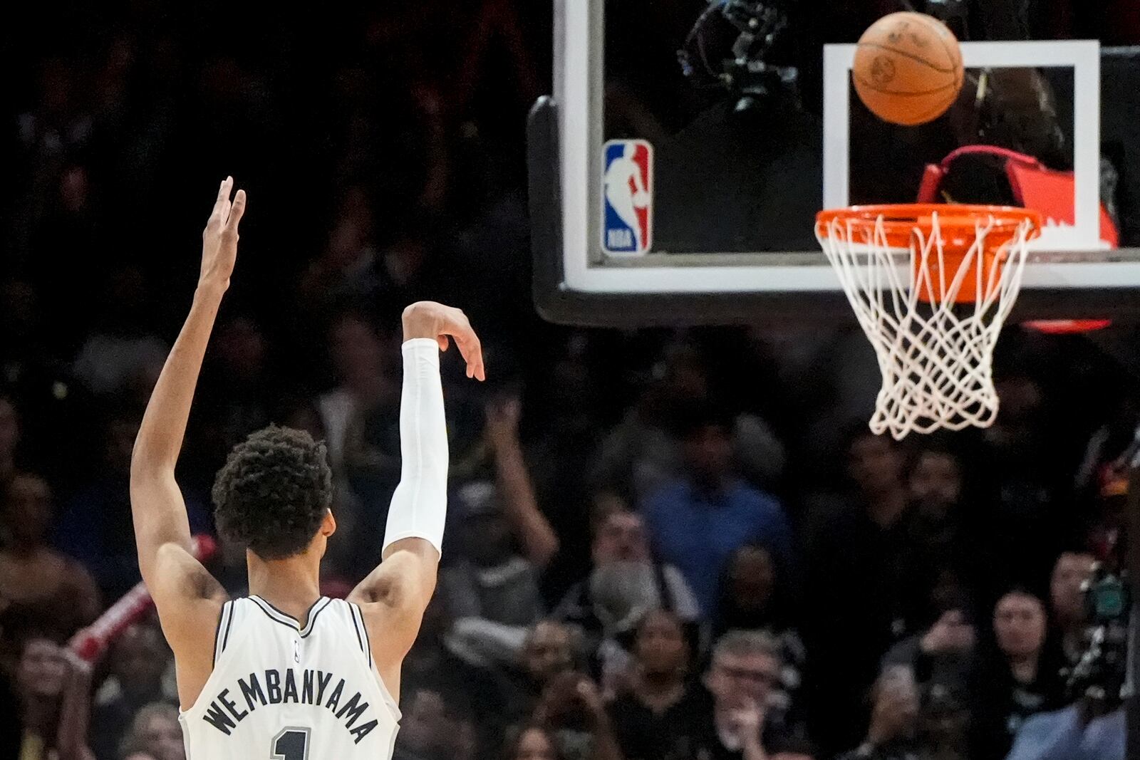 San Antonio Spurs center Victor Wembanyama (1) shoots the winning basket from the line against the Atlanta Hawks during the second half of an NBA basketball game, Wednesday, Feb. 5, 2025, in Atlanta. (AP Photo/Mike Stewart)