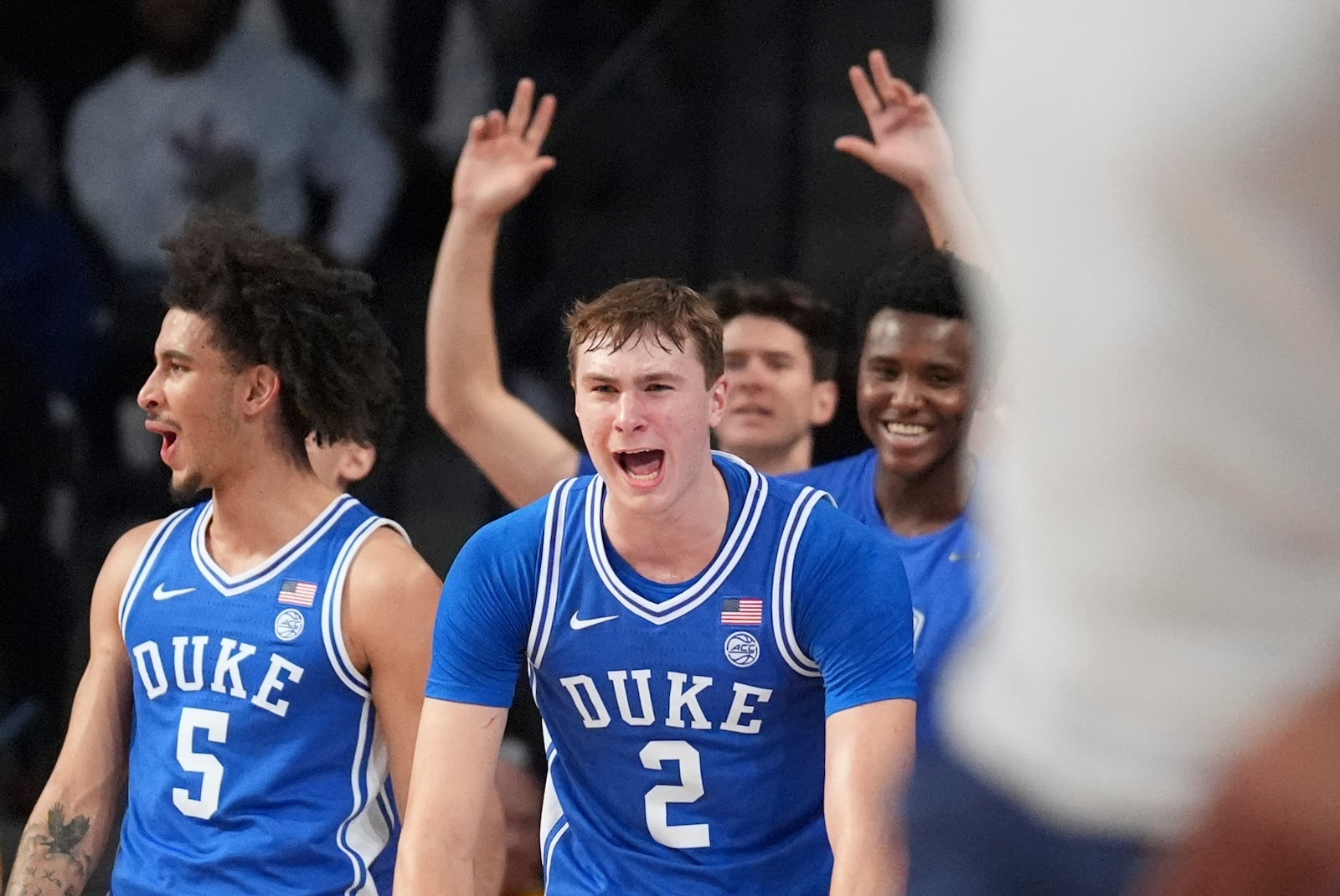 Duke guard Cooper Flagg (2) celebrates his teammates scoring during the second half of an NCAA college basketball game against Georgia Tech on Saturday, Dec. 21, 2024 in Atlanta. (AP Photo/Brynn Anderson)