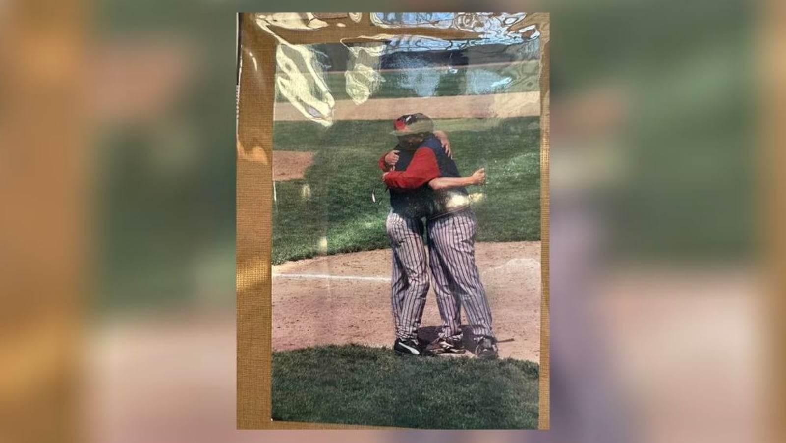 Former coach Mark Stoll hugging Steve Leep. Contributed