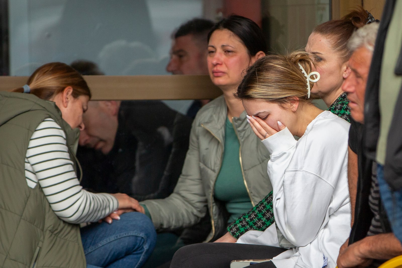 A woman cries outside a hospital in the town of Kocani, North Macedonia, Sunday, March 16, 2025, following a massive fire in a nightclub early Sunday. (AP Photo/Visar Kryeziu)