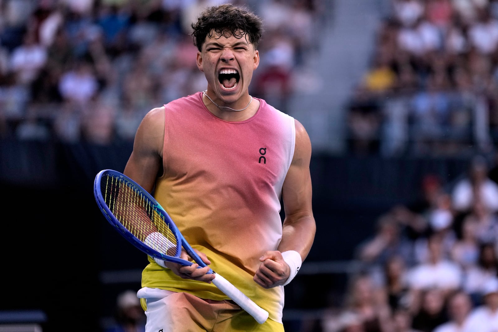 Ben Shelton of the U.S. reacts after winning a point against Lorenzo Musetti of Italy in their third round match at the Australian Open tennis championship in Melbourne, Australia, Saturday, Jan. 18, 2025. (AP Photo/Ng Han Guan)