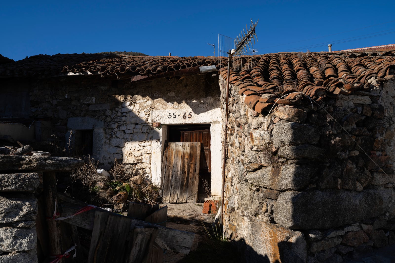 An abandoned house in the village of Bustarviejo, on the outskirts of Madrid, Spain, Tuesday, Jan. 14, 2025. (AP Photo/Bernat Armangue)