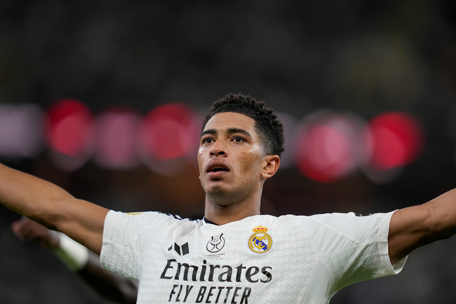 Real Madrid's Jude Bellingham celebrates after scoring his side's opening goal during the Spanish Super Cup semifinal soccer match between Real Madrid and Mallorca at the King Abdullah Stadium in Jeddah, Saudi Arabia, Thursday, Jan. 9, 2025. (AP Photo/Altaf Qadri)