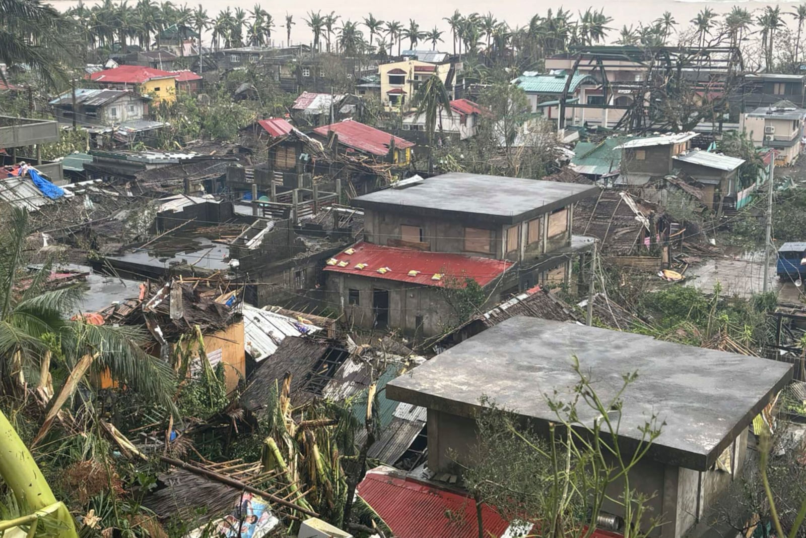 This photo provided by the MDRRMO Viga Catanduanes, shows damaged houses caused by Typhoon Man-yi in Viga, Catanduanes province, northeastern Philippines Sunday, Nov. 17, 2024. (MDRRMO Viga Catanduanes via AP)