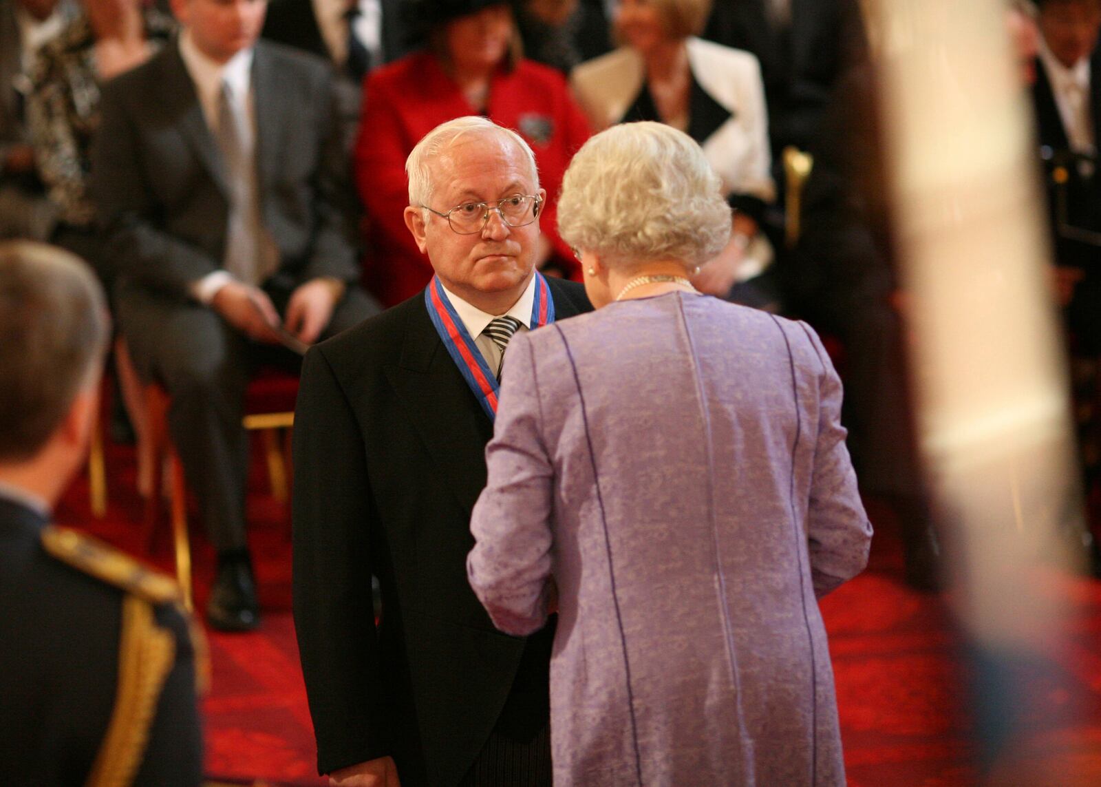 Former Soviet spy Oleg Gordievsky after receives the Companion of the Most Distinguished Order of St Michael and Saint George from Queen Elizabeth II at Buckingham Palace in London, Oct. 17, 2007. (Martin Keene/PA via AP, file)