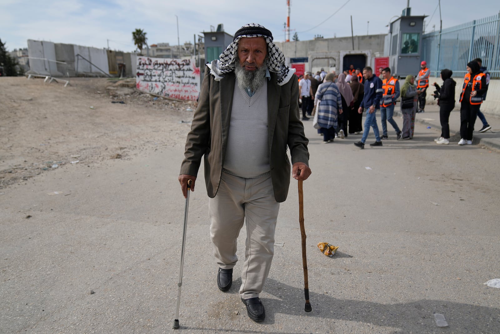 A Palestinian man leaves after he was not allowed to cross from the Israeli military Qalandia checkpoint near the West Bank city of Ramallah to Jerusalem, to participate in the Friday prayers at the Al-Aqsa Mosque compound during the Muslim holy month of Ramadan on Friday, March 14, 2025. (AP Photo/Nasser Nasser)