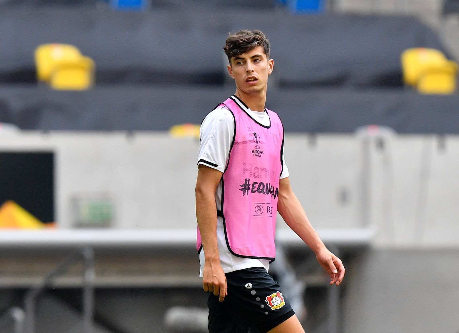 FILE - In this Sunday Aug. 9, 2020 file photo, Leverkusen's Kai Havertz looks around during a training session in Duesseldorf, Germany. Bayer Leverkusen forward Kai Havertz left the Germany national team training camp on Friday, Sept. 4 to try to complete his transfer to Chelsea. Leverkusen sports director Rudi Voeller said Havertz is traveling to London “so that Kai can now sort things out on the ground in London with our support.” (AP Photo/Martin Meissner, file)