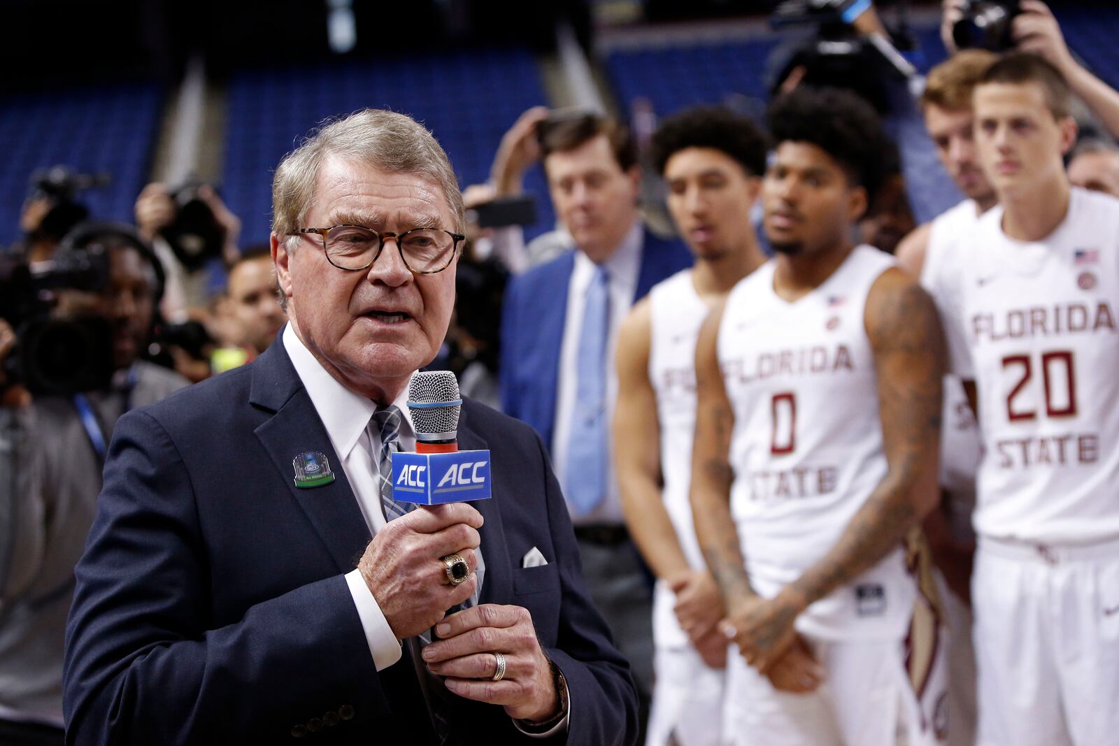 FILE - ,John Swofford, commissioner of the Atlantic Coast Conference, announces the cancellation of the NCAA college basketball games at the ACC tournament due to concerns about the coronavirus, Thursday, March 12, 2020, in Greensboro, N.C. (AP Photo/Ben McKeown, File)