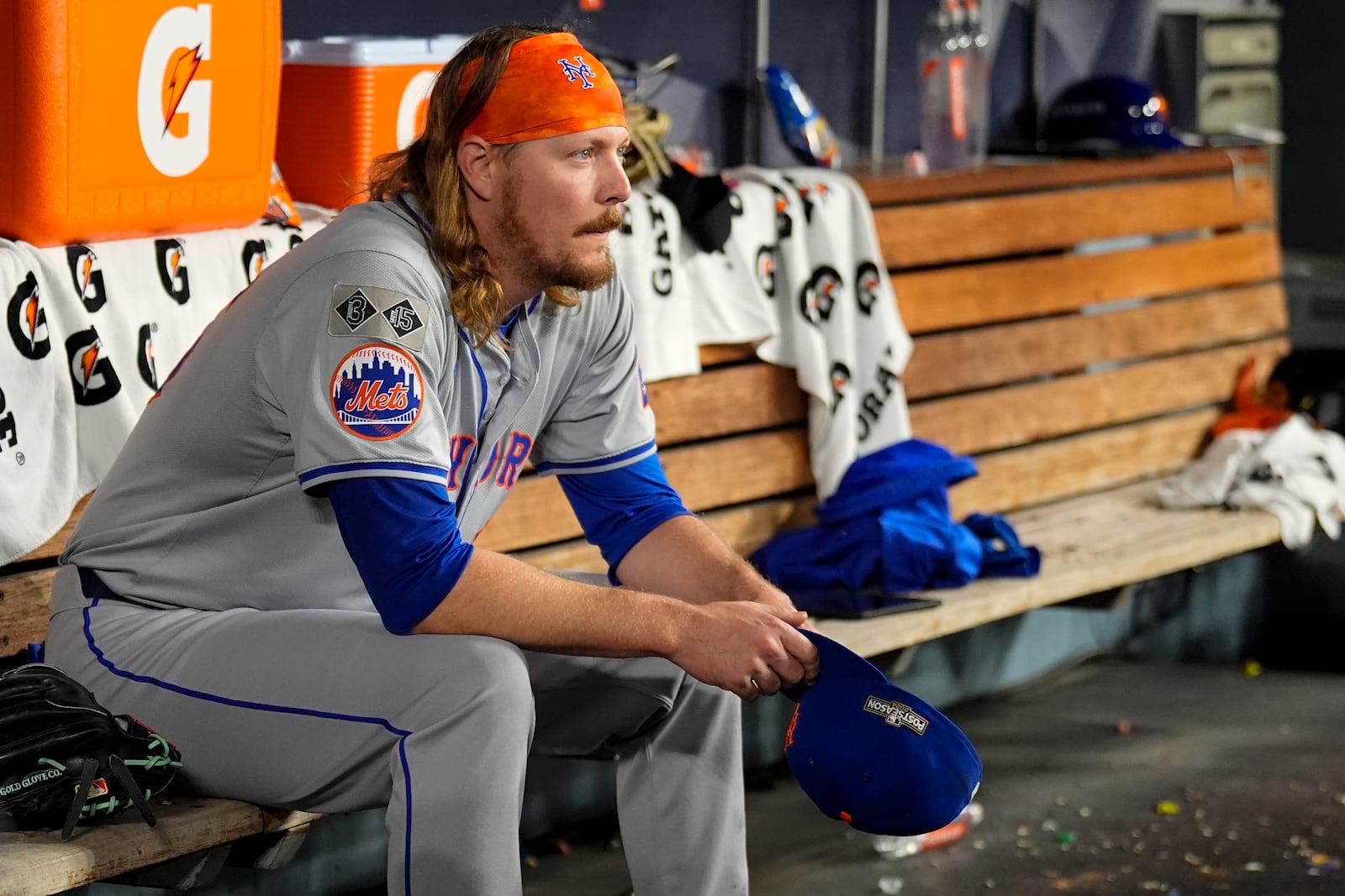 New York Mets pitcher Ryne Stanek sits in the dugout after leaving to games against the Los Angeles Dodgers during the sixth inning in Game 6 of a baseball NL Championship Series, Sunday, Oct. 20, 2024, in Los Angeles. (AP Photo/Julio Cortez)