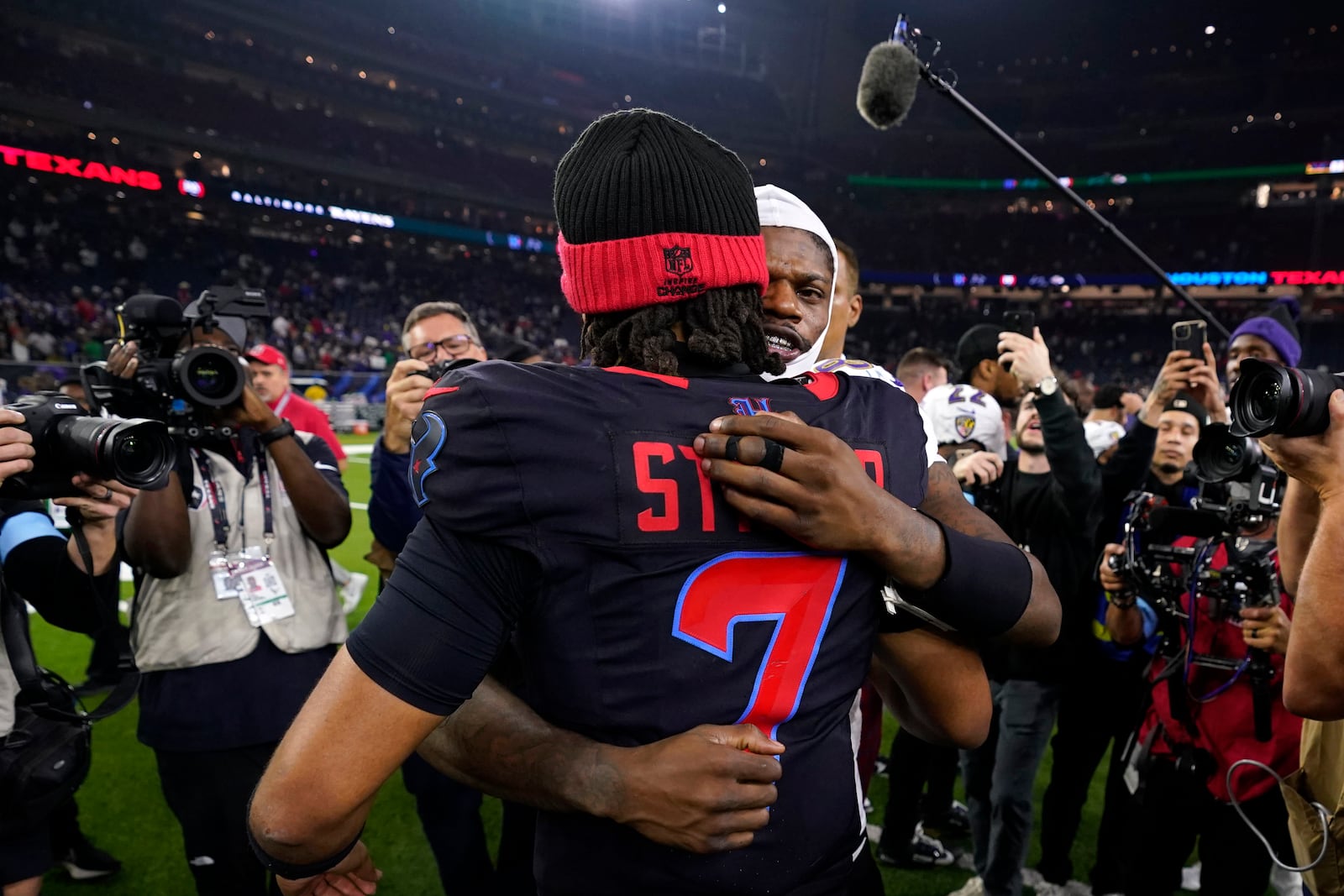 Houston Texans quarterback C.J. Stroud (7) hugs Baltimore Ravens quarterback Lamar Jackson after an NFL football game, Wednesday, Dec. 25, 2024, in Houston. (AP Photo/Eric Christian Smith)