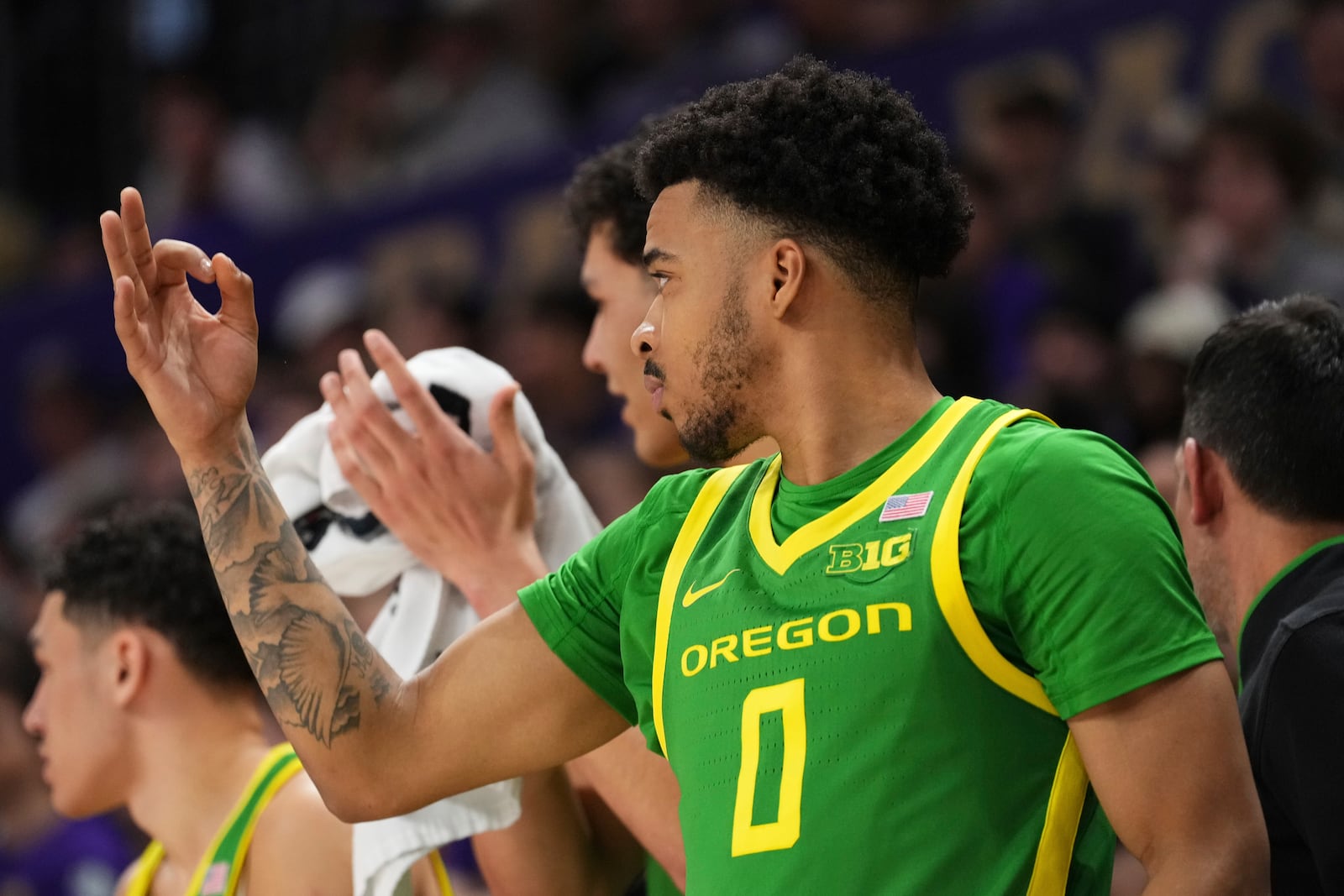 Oregon guard Ra'Heim Moss reacts on the bench during the second half of an NCAA college basketball game against Washington, Sunday, March 9, 2025, in Seattle. (AP Photo/Lindsey Wasson)