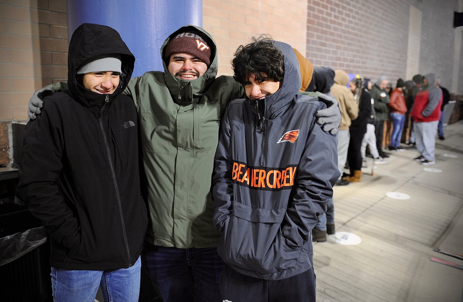 From left, Nathan Padilla, Alexander Padilla and Andrew Padilla were first in line at the Best Buy in Beavercreek, Friday Nov. 26, 2021. MARSHALL GORBY \STAFF