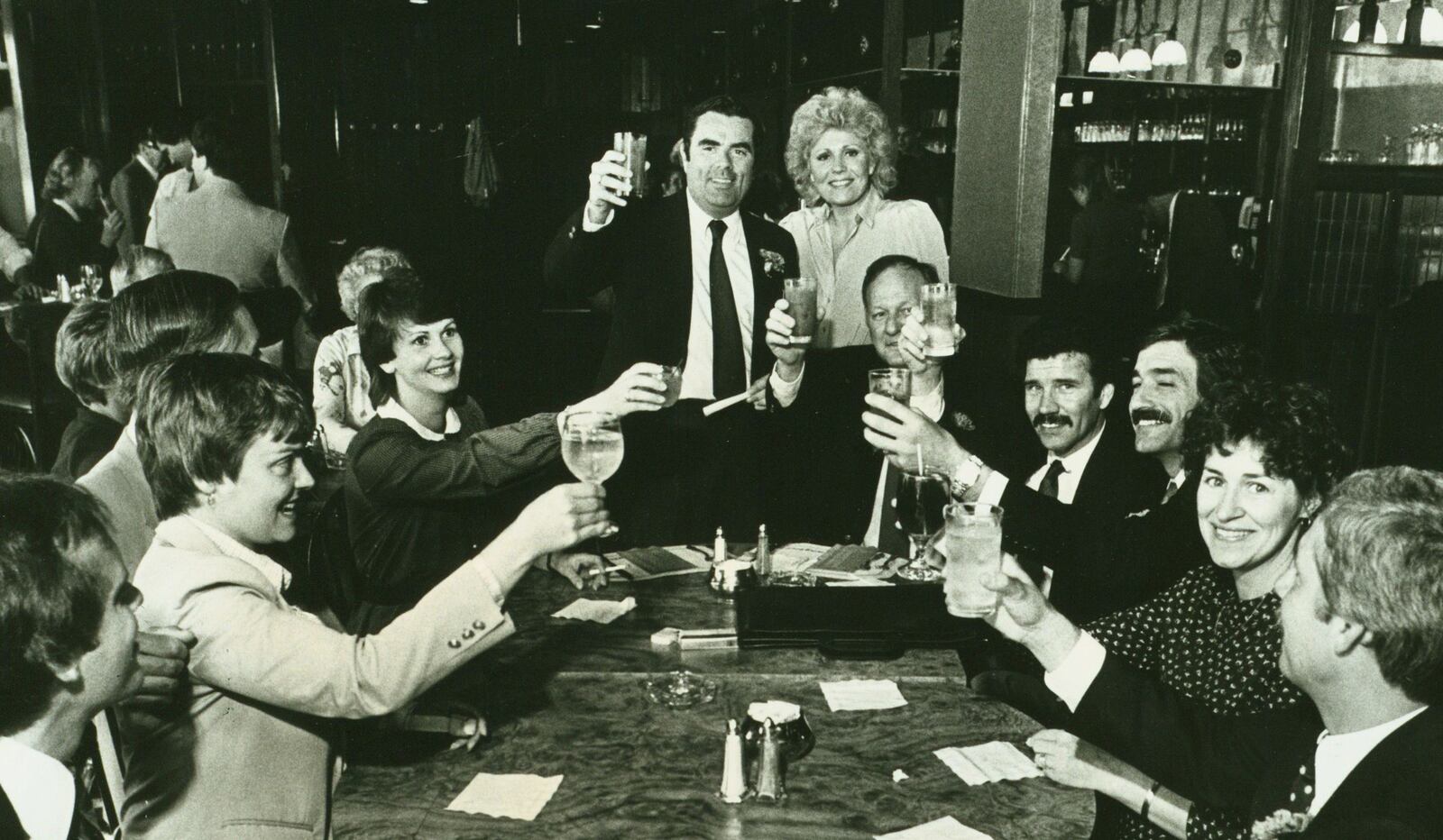 Patrick Flanagan, standing, a former Montgomery County GOP chairman and Dayton attorney, leads a toast at Langtree's Restaurant in 1982. DAYTON DAILY NEWS / WRIGHT STATE UNIVERSITY SPECIAL COLLECTIONS