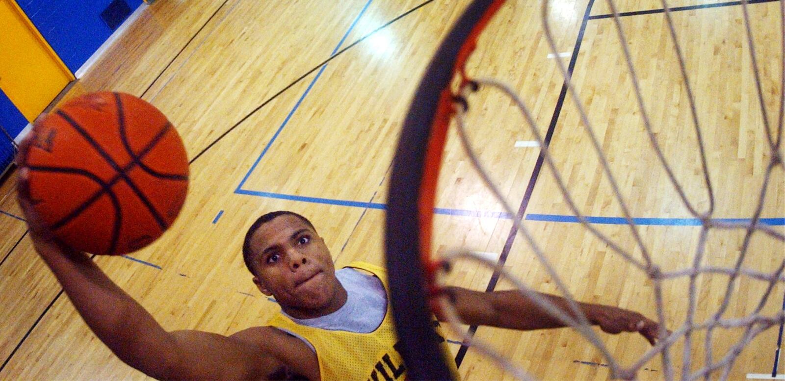 December 9, 2004 News-Sun/Teesha McClam SLUG:snsNateMillerA120904tm.JPG South’s Nate Miller goes for slam dunk during practice at South High School.