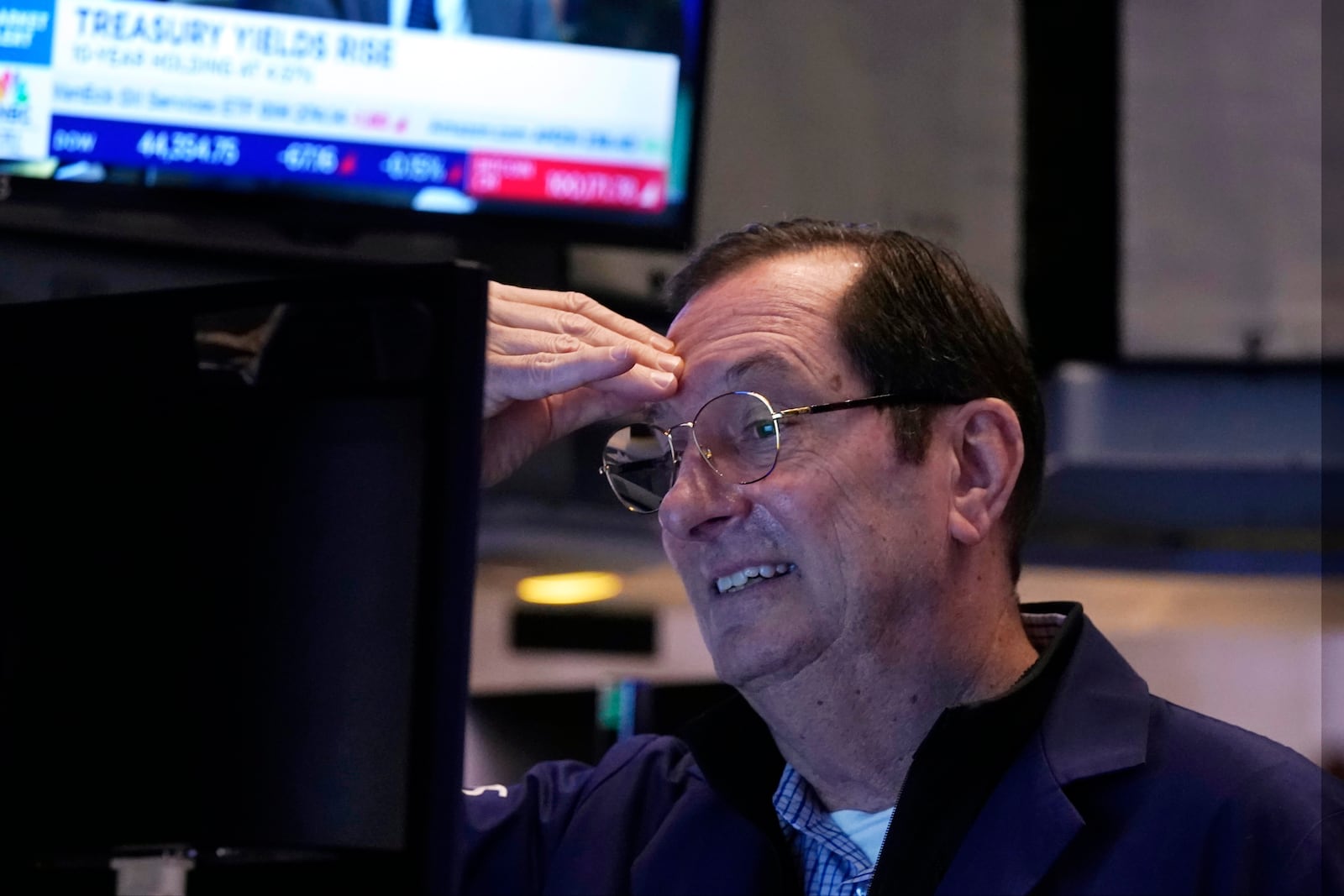 Trader William O'Keefe works on the floor of the New York Stock Exchange, Tuesday, Feb. 4, 2025. (AP Photo/Richard Drew)