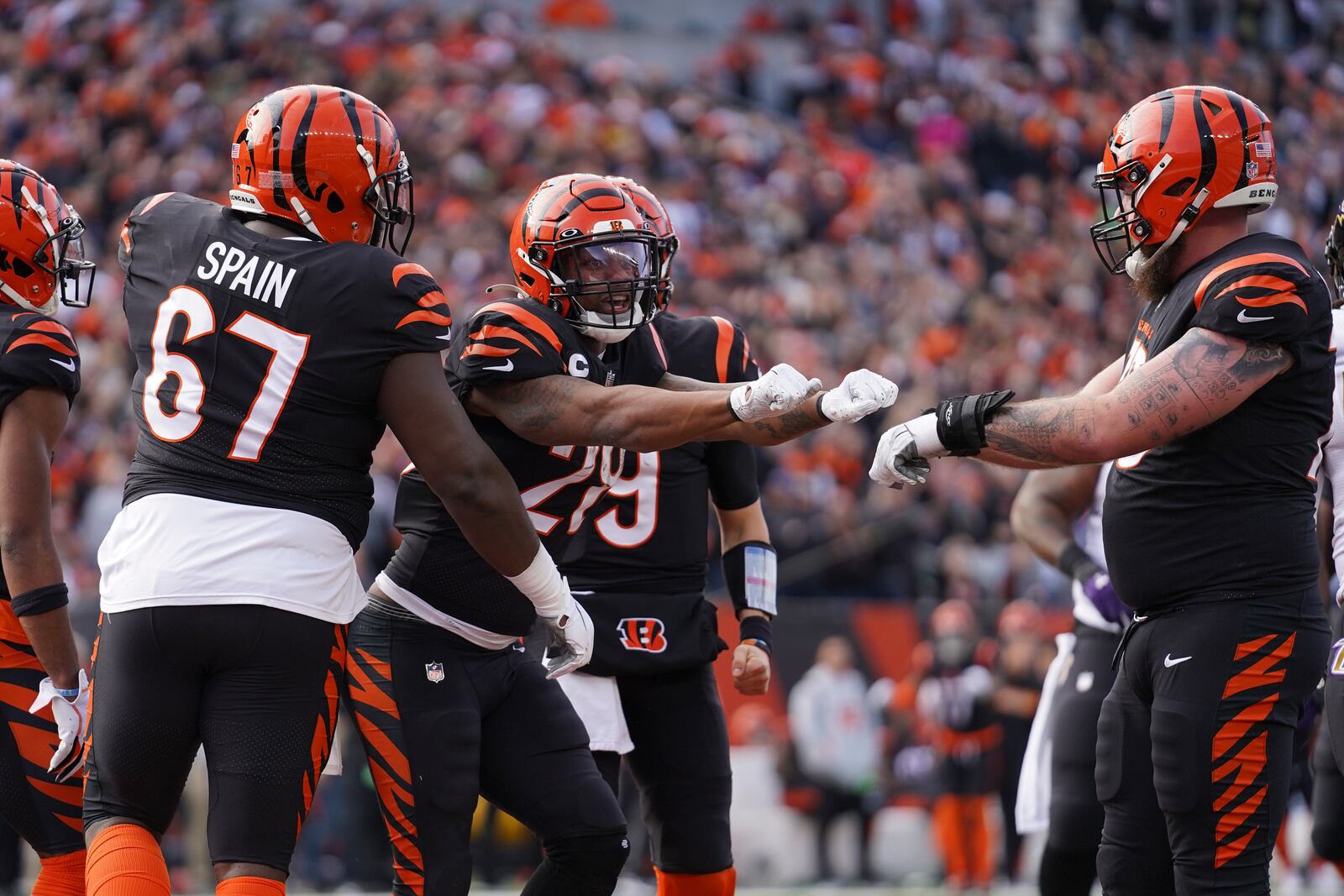 Cincinnati Bengals' Joe Mixon (28) celebrates after scoring a touchdown during the first half of an NFL football game against the Baltimore Ravens, Sunday, Dec. 26, 2021, in Cincinnati. (AP Photo/Jeff Dean)