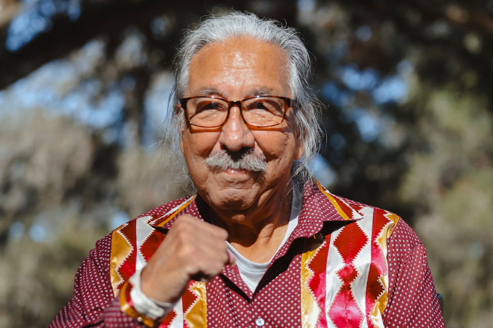 In this photo released by NDN Collective, Native American activist Leonard Peltier poses for pictures as he was released from a Florida prison on Tuesday, Feb. 18, 2025, weeks after then-President Joe Biden angered law enforcement officials by commuting his life sentence to home confinement in the 1975 killings of two FBI agents. (Angel White Eyes, NDN Collective via AP)