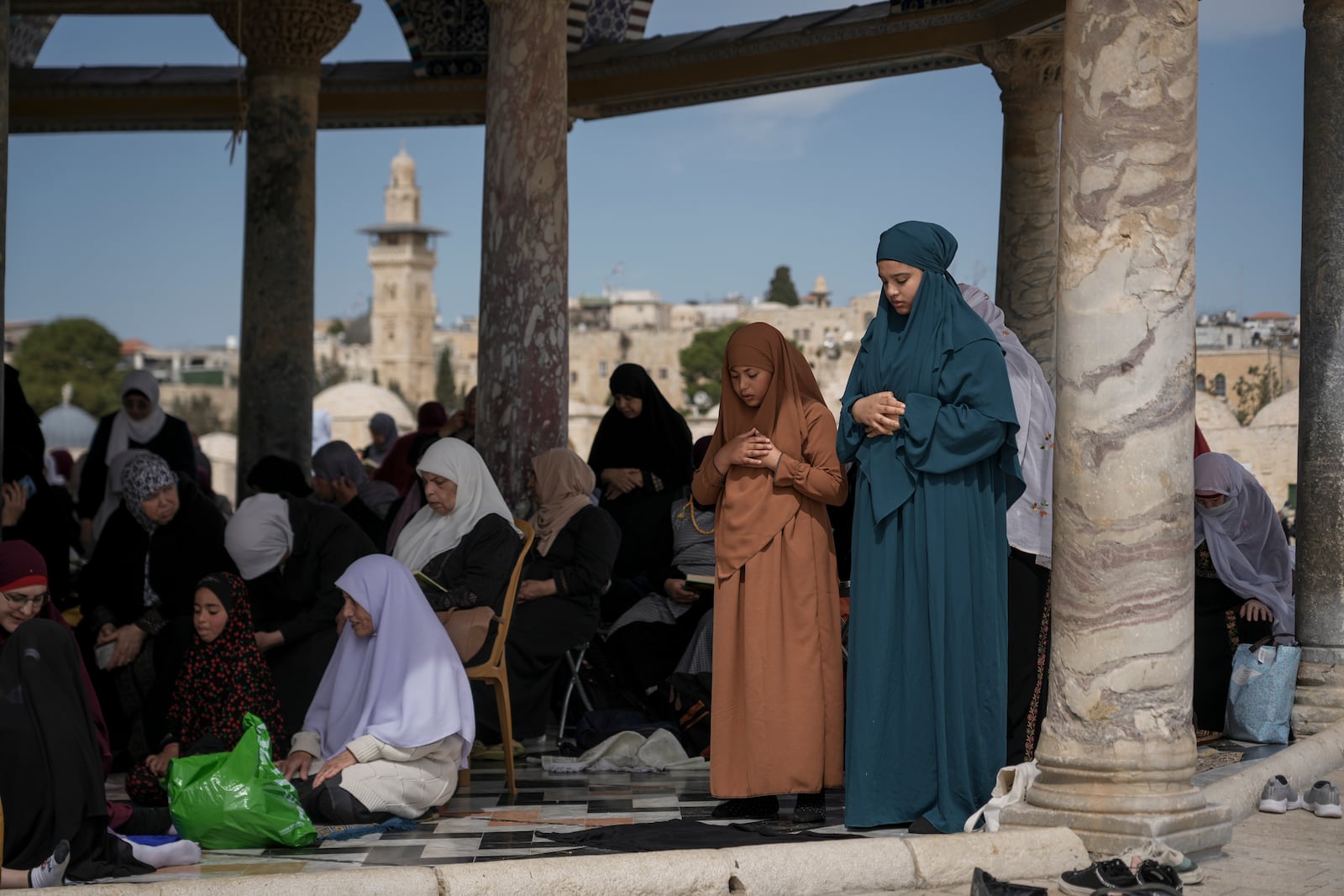 Palestinian women perform Friday prayers at the Al-Aqsa Mosque compound in the Old City of Jerusalem, during the Muslim holy month of Ramadan, Friday, March 14, 2025. (AP Photo/Mahmoud Illean)