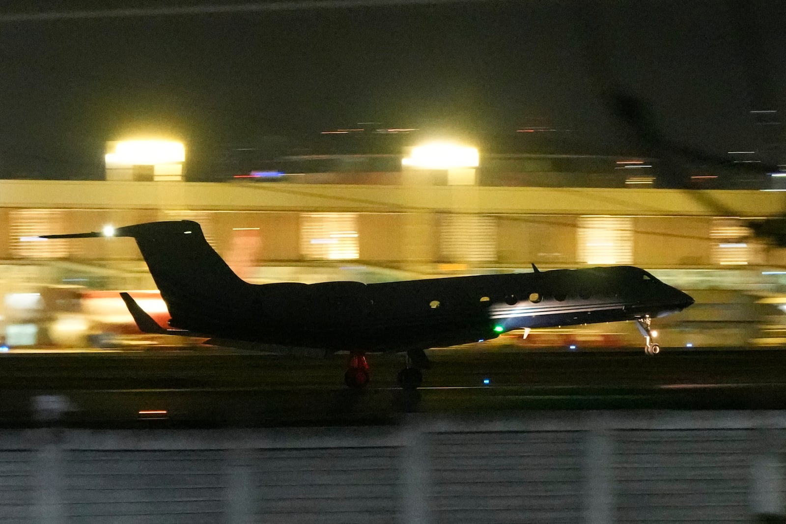 A plane carrying former President Rodrigo Duterte to The Hague takes off in Manila, Philippines on Tuesday, March 11, 2025. (AP Photo/Aaron Favila)