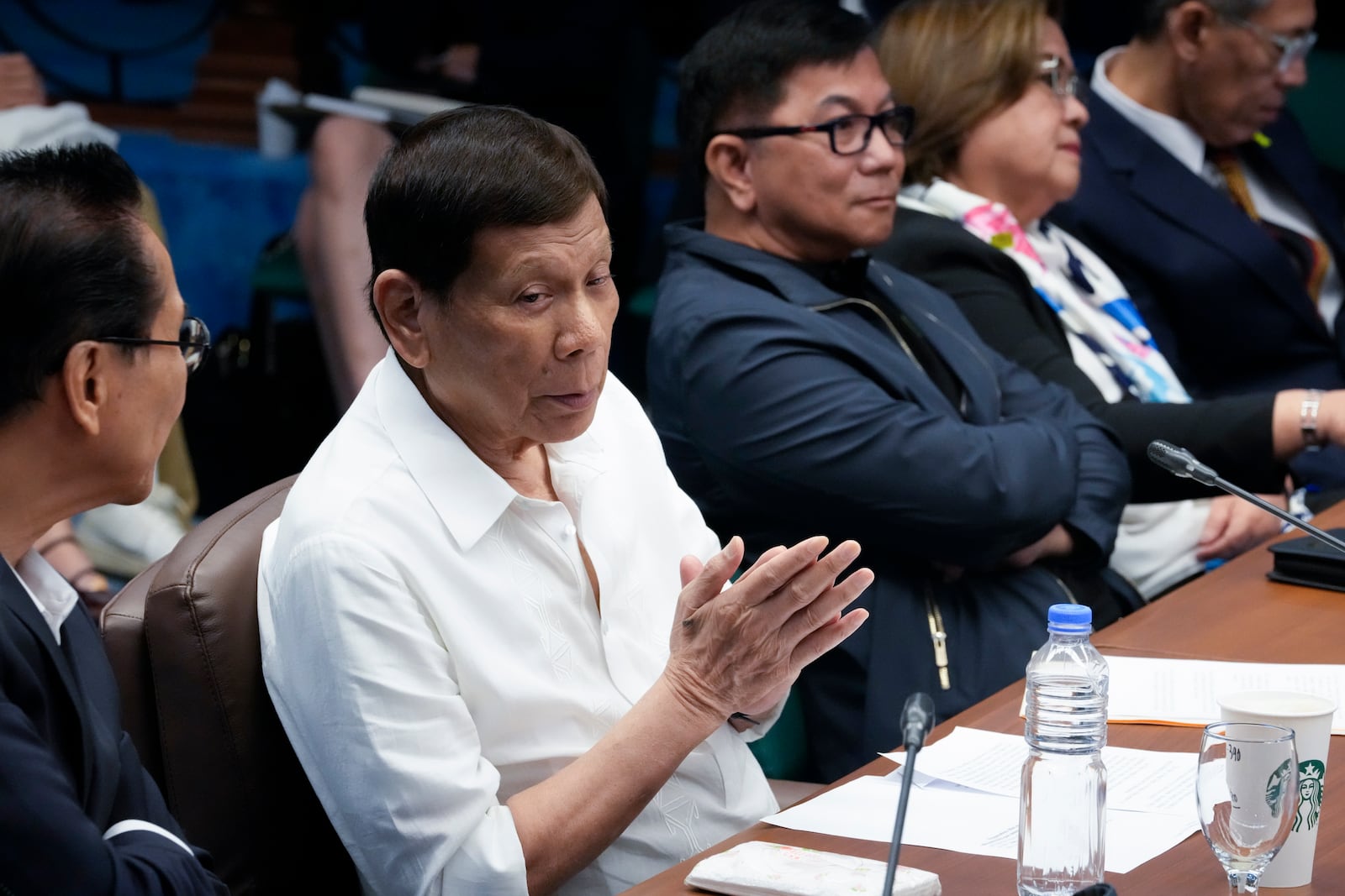 Former Philippine President Rodrigo Duterte listens during a senate investigation on the war on the drugs during his administration, at the Philippine Senate, Monday, Oct. 28, 2024, in Manila, Philippines. (AP Photo/Aaron Favila)