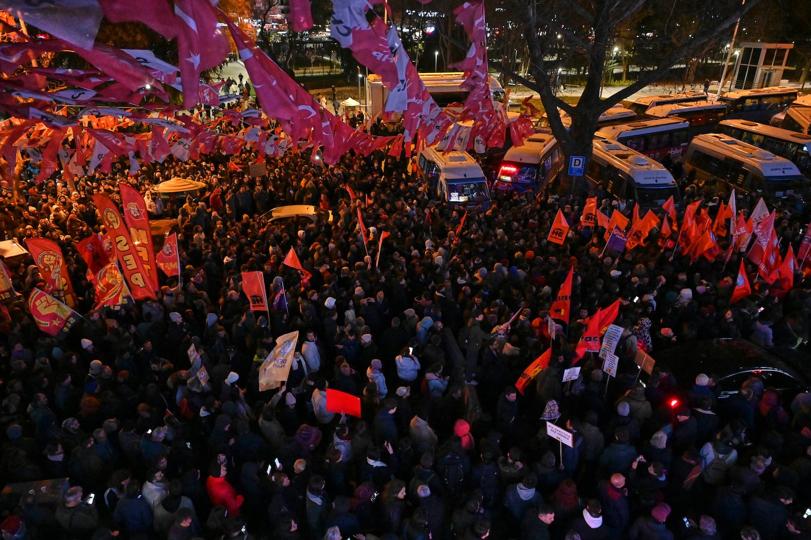 People gather outside the headquarters of the opposition Republican People's Party or (CHP), to protest the arrest of Istanbul Mayor Ekrem Imamoglu in Ankara, Turkey, Wednesday, March 19, 2025. (AP Photo/Ali Unal)