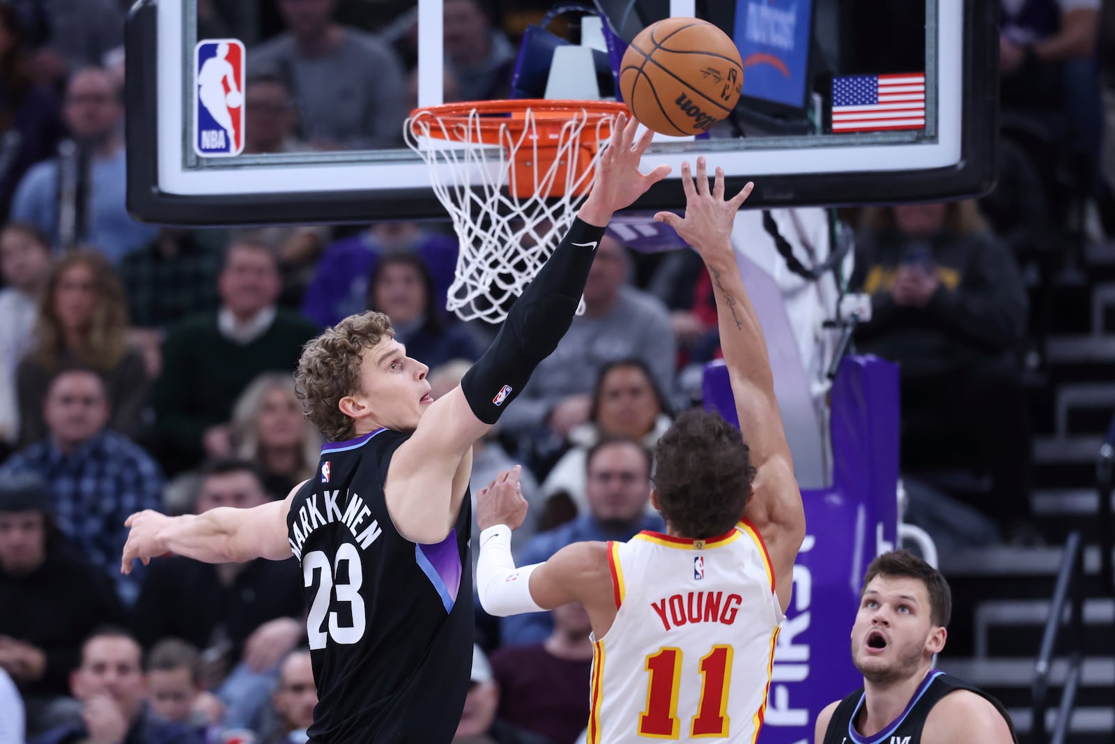 Utah Jazz forward Lauri Markkanen (23) blocks the shot of Atlanta Hawks guard Trae Young (11) during the fourth quarter of an NBA basketball game, Tuesday, Jan. 7, 2025, in Salt Lake City. (AP Photo/Rob Gray)