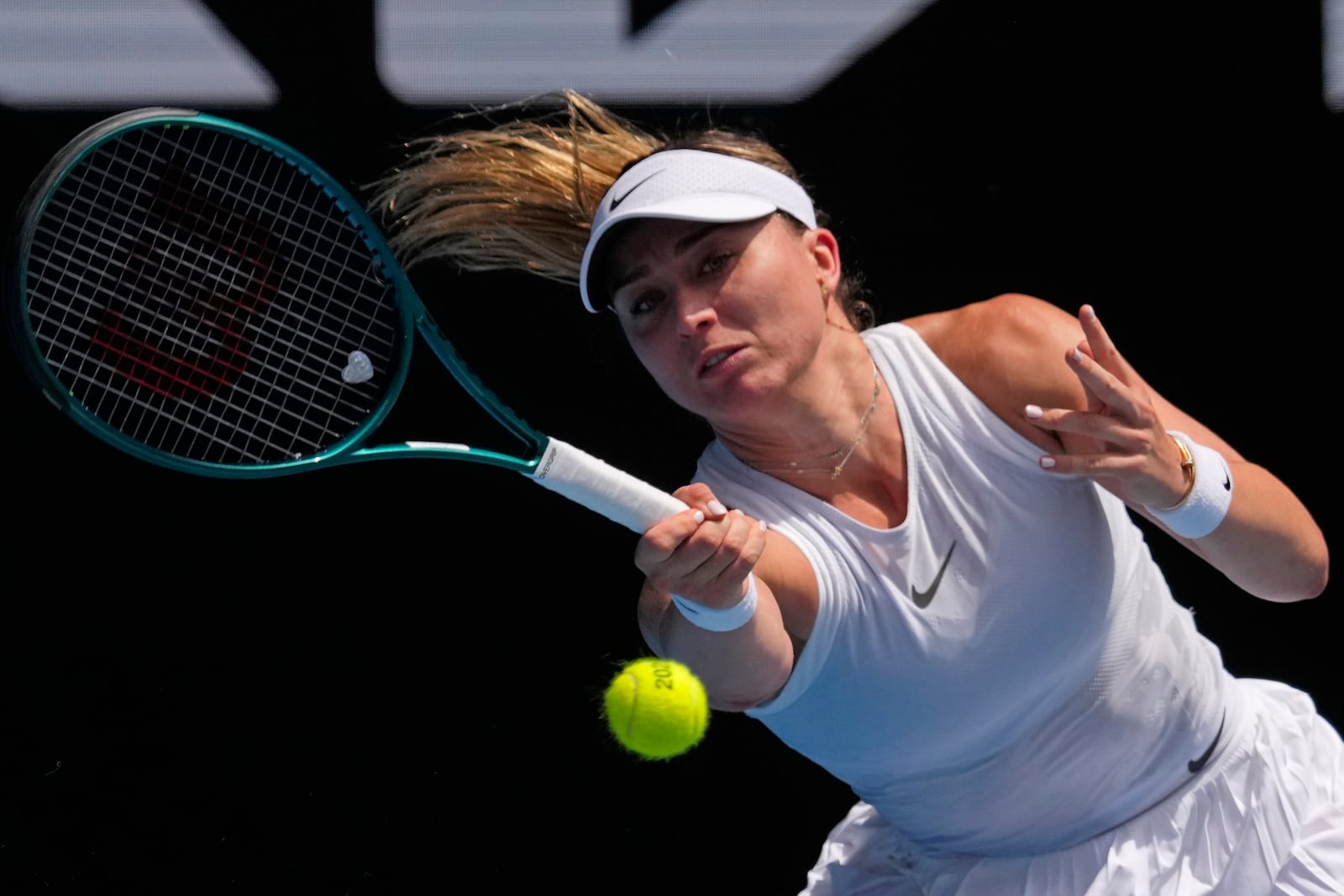 Paula Badosa of Spain returns a shot from Olga Danilovic of Serbia during their fourth round match at the Australian Open tennis championship in Melbourne, Australia, Sunday, Jan. 19, 2025. (AP Photo/Vincent Thian)