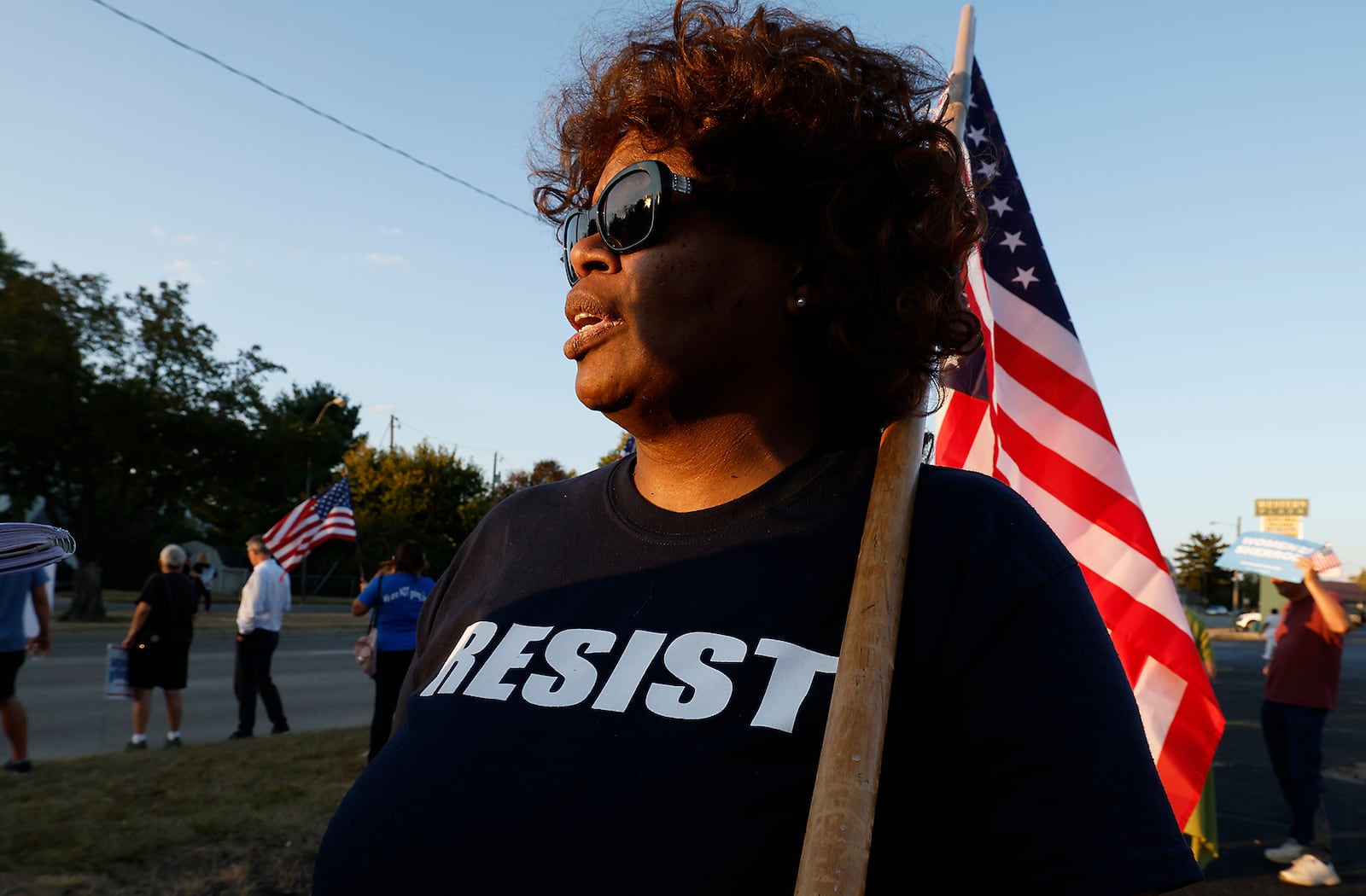 Shonda Sneed, from Yellow Springs, talks about the Haitian immigrants during a Peace Rally at the Clark County Democratic Party on Park Road in Springfield Wednesday. BILL LACKEY/STAFF