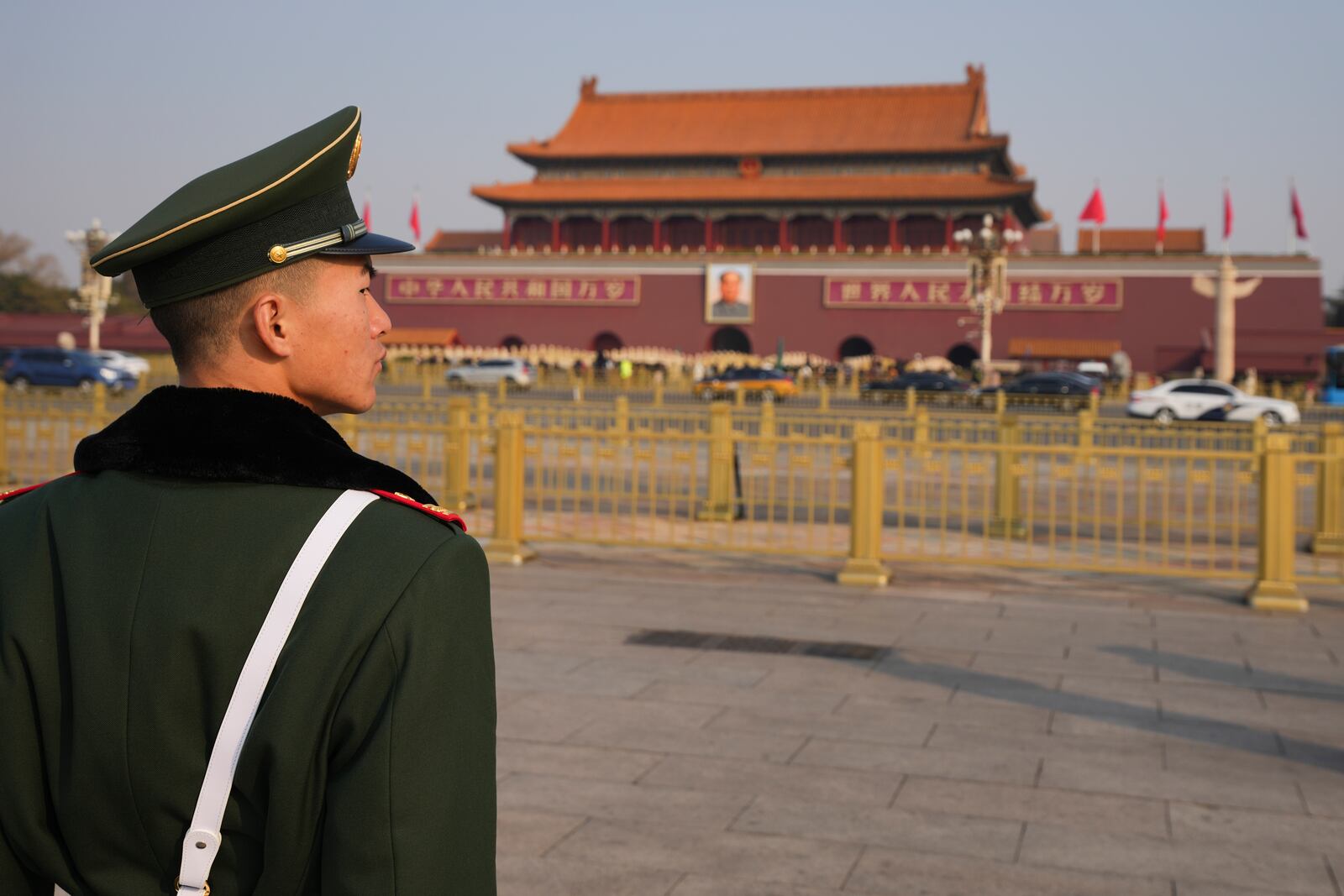 A paramilitary police officer stands guard in Tiananmen Square during the opening session of the National People's Congress (NPC) at the Great Hall of the People in Beijing, China, Wednesday, March 5, 2025. (AP Photo/Vincent Thian)