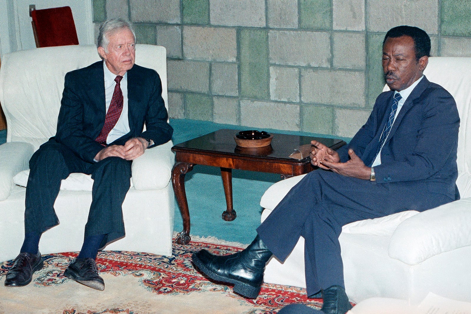 FILE - Former U.S. President Jimmy Carter, left, speaks with Ethiopian President Mengistu Haile Mariam in Addis Ababa, July 11, 1990, during the 26th summit of the Organization of African Unity. (AP Photo/Aris Saris, File)