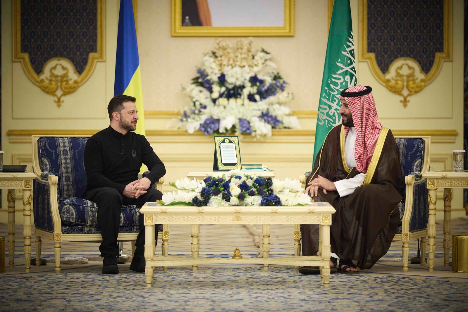 In this photo provided by the Ukrainian Presidential Press Office, Ukrainian President Volodymyr Zelenskyy, left, meets with Saudi's Crown Prince Mohammed bin Salman at the Royal Palace in Riyadh, Saudi Arabia, Monday, March 10, 2025. (Ukrainian Presidential Press Office via AP)