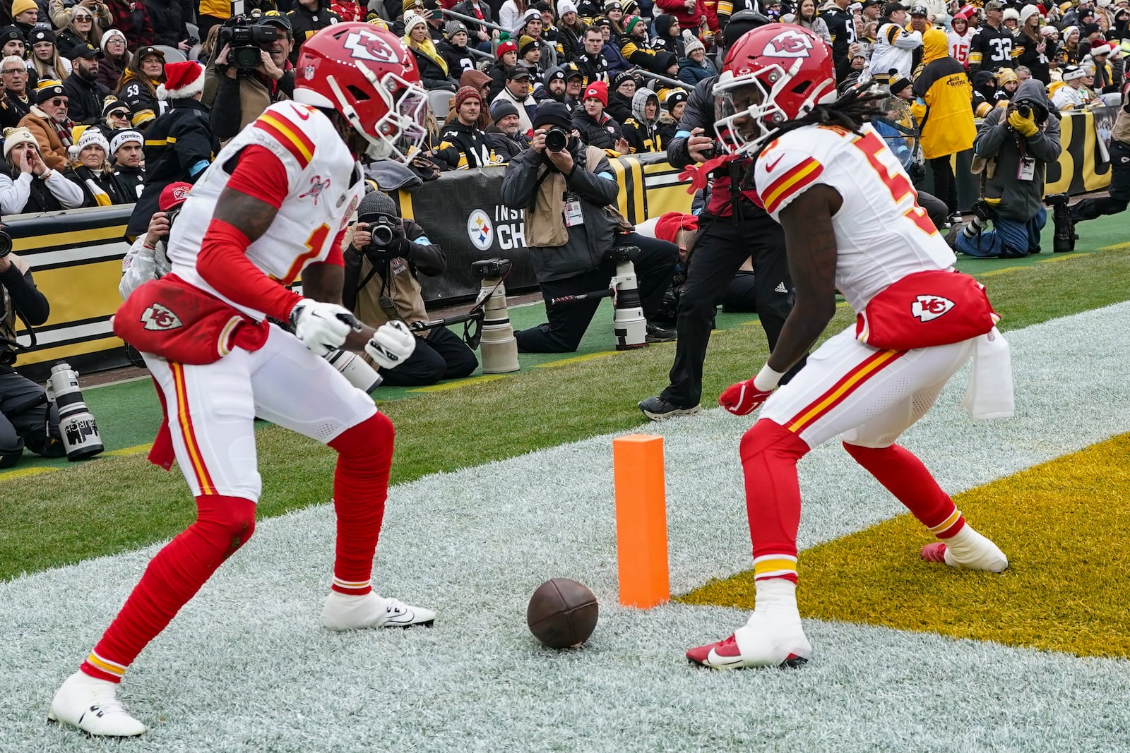 Kansas City Chiefs wide receiver Xavier Worthy (1) celebrates his touchdown with Hollywood Brown (5) during the first half of an NFL football game against the Pittsburgh Steelers, Wednesday, Dec. 25, 2024, in Pittsburgh. (AP Photo/Matt Freed)