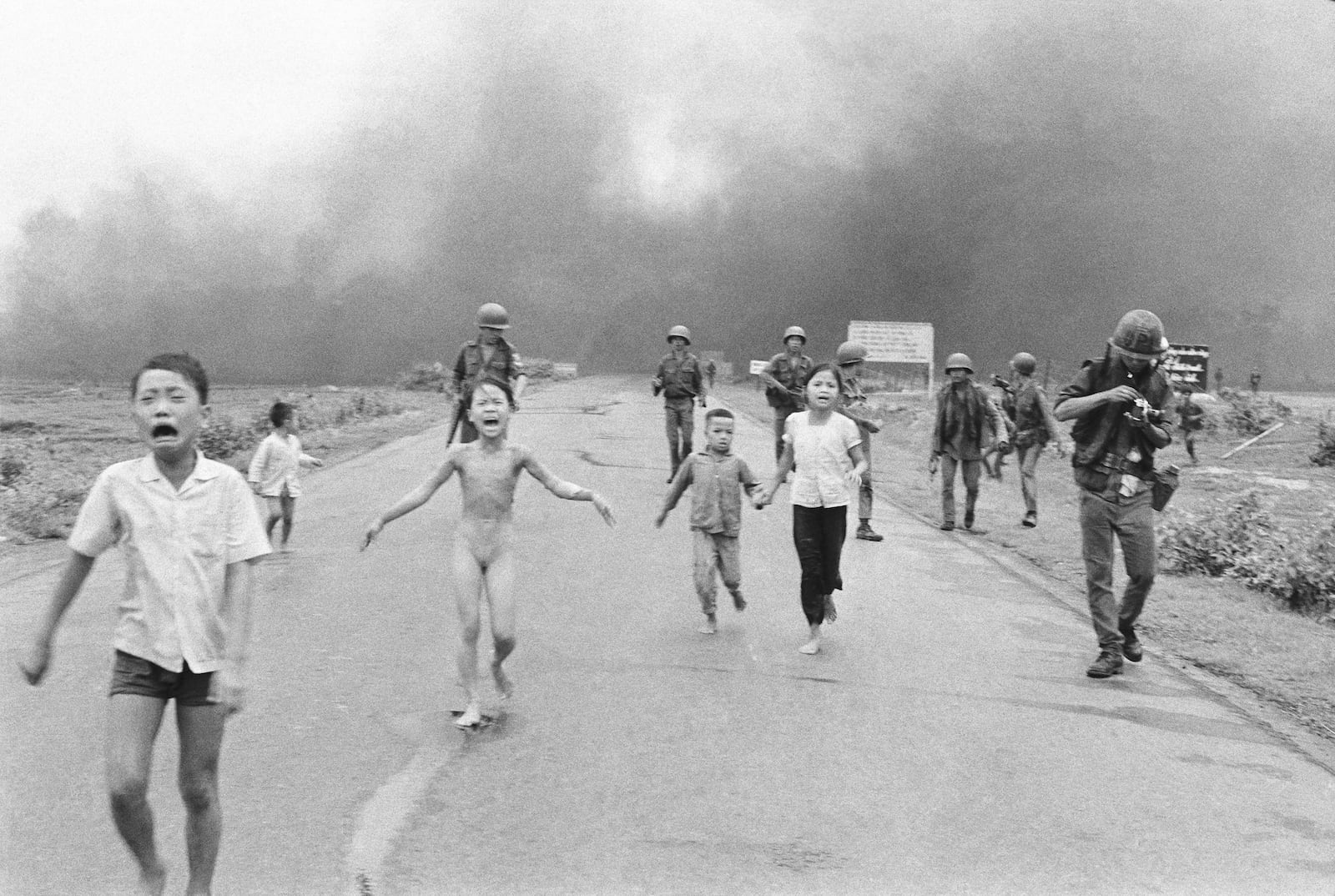 FILE - South Vietnamese forces follow after terrified children, including 9-year-old Kim Phuc, center, as they run down Route 1 near Trang Bang after an aerial napalm attack on suspected Viet Cong hiding places, June 8, 1972. (AP Photo/Nick Ut, File)