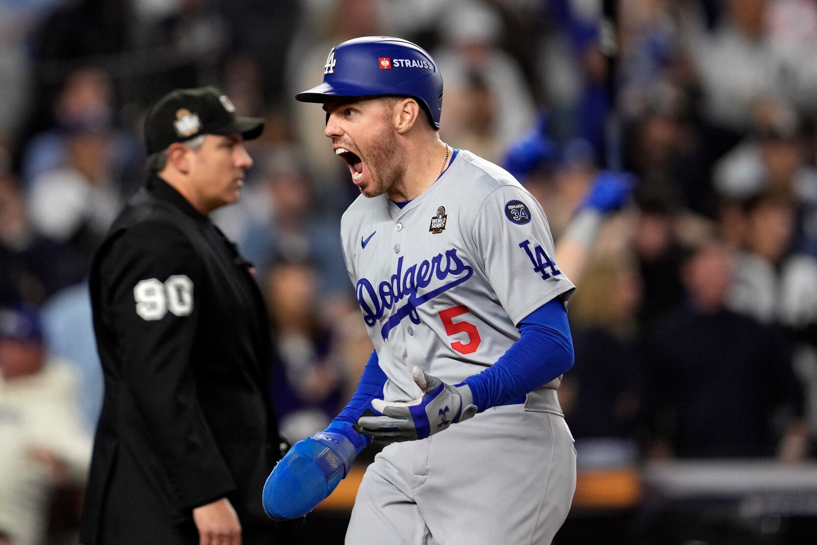 Los Angeles Dodgers' Freddie Freeman reacts after scoring against the New York Yankees during the fifth inning in Game 5 of the baseball World Series, Wednesday, Oct. 30, 2024, in New York. (AP Photo/Godofredo A. Vásquez)