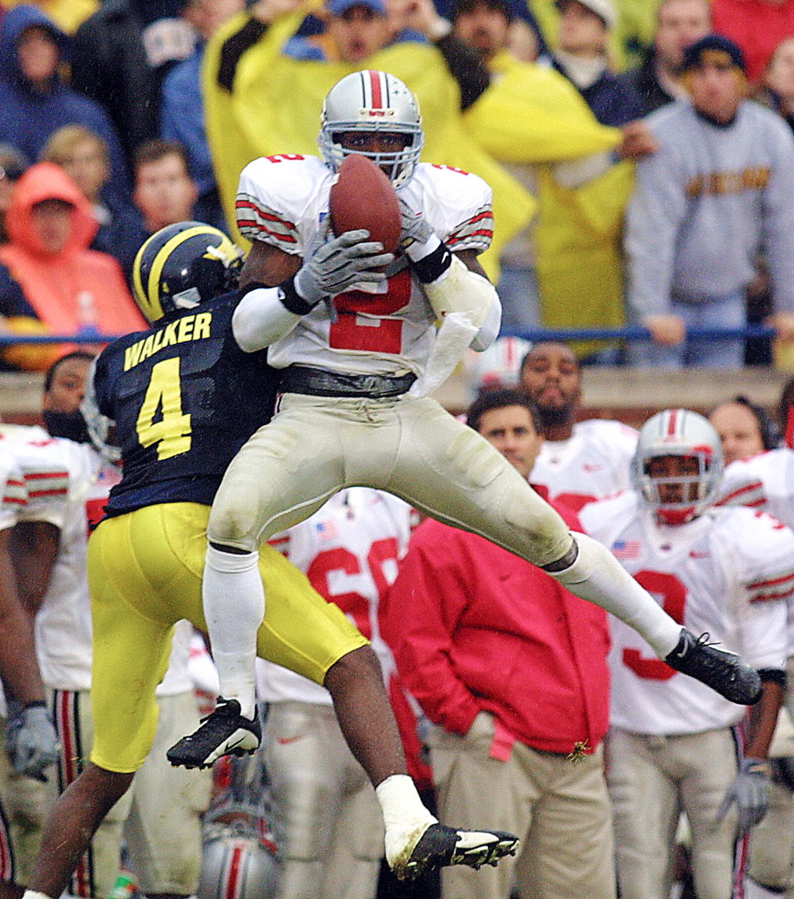 24 Nov 2001: Mike Doss #2 of Ohio State intercepts the ball over Wide Receiver Marquise Walker #4 of Michigan in the second half at  Michigan Stadium in Ann Arbor, Michigan. The Buckeyes beat the Wolverines 26-20. DIGITAL IMAGE Mandatory Credit: Danny Moloshok/ALLSPORT