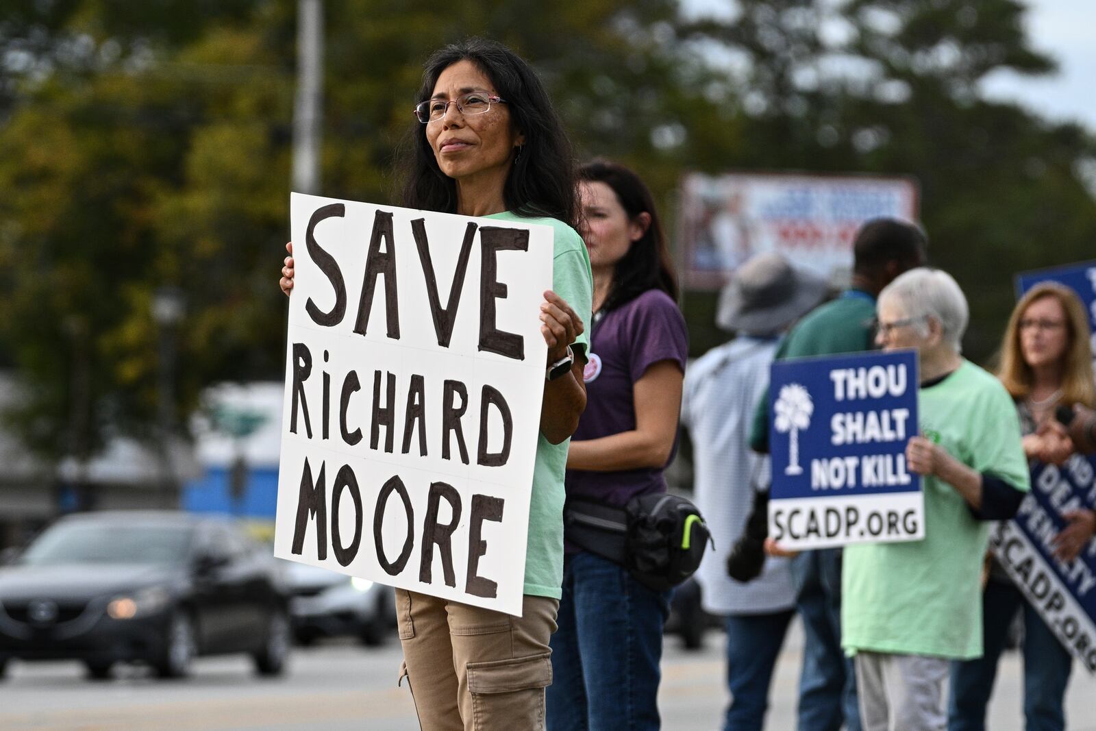 Protestors look on prior to the scheduled execution of Richard Moore, Friday, Nov. 1, 2024, outside of Broad River Correctional Institution in Columbia, S.C. (AP Photo/Matt Kelley)