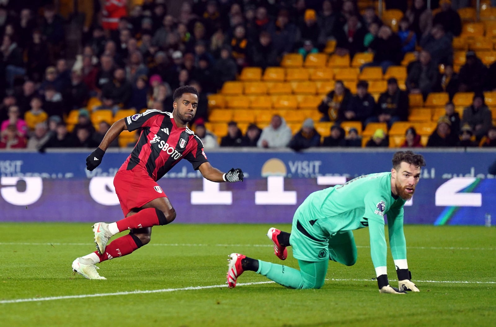 Fulham's Ryan Sessegnon scores their side's first goal of the game during the English Premier League soccer match between Wolverhampton Wanderers and Fulham at Molineux Stadium, Wolverhampton, England, Tuesday, Feb. 25, 2025. (Jacob King/PA via AP)