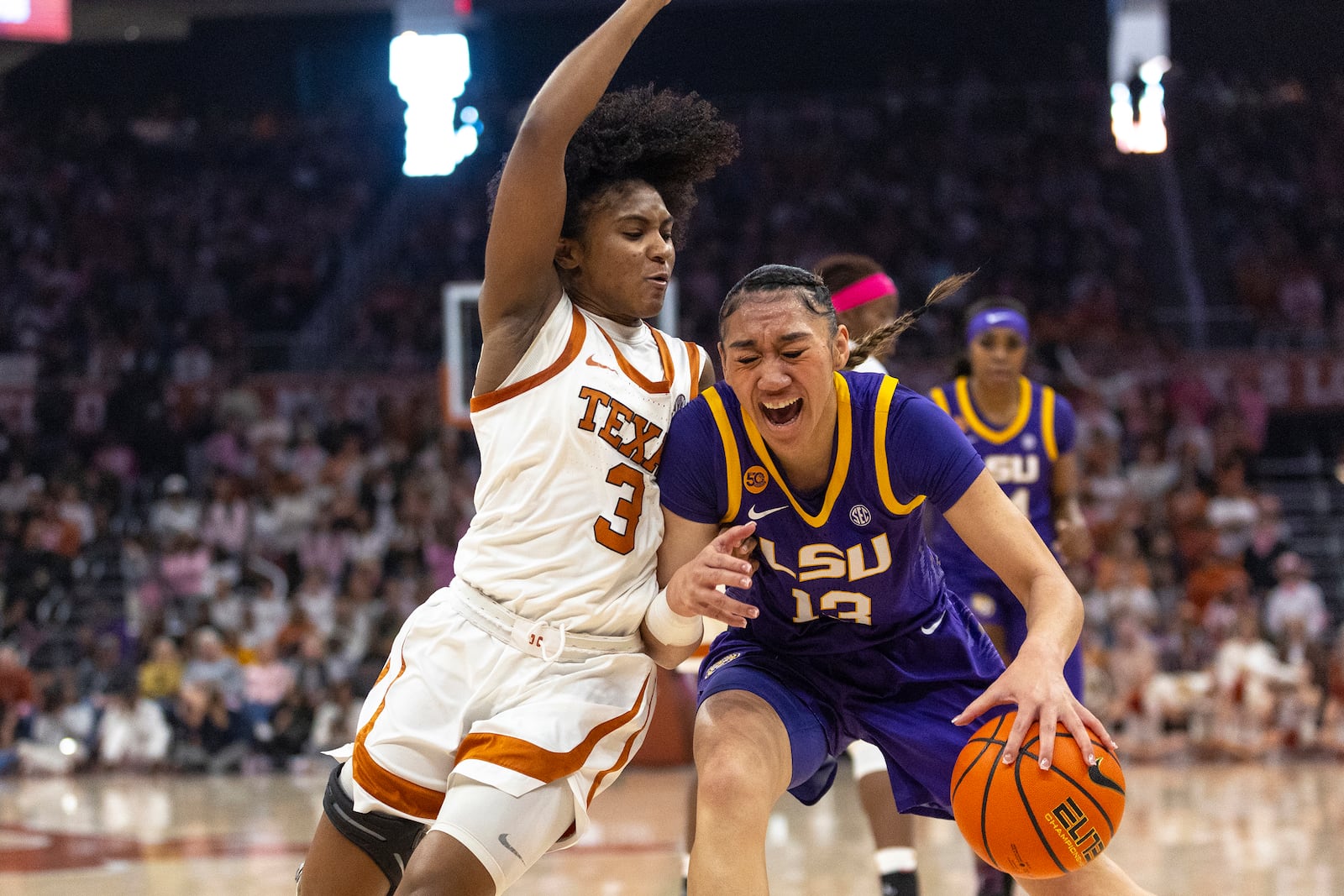 Texas guard Rori Harmon (3) defends LSU guard Last-Tear Poa (13) during the first half of an NCAA college basketball game in Austin, Texas, Sunday, Feb. 16, 2025. (AP Photo/Stephen Spillman)