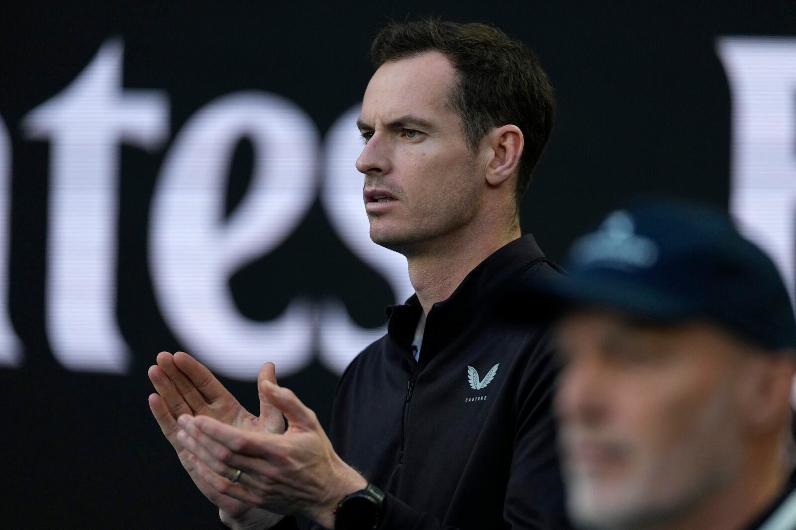 Andy Murray, coach of Novak Djokovic of Serbia watches his first round match against Nishesh Basavareddy of the U.S. at the Australian Open tennis championship in Melbourne, Australia, Monday, Jan. 13, 2025. (AP Photo/Asanka Brendon Ratnayake)