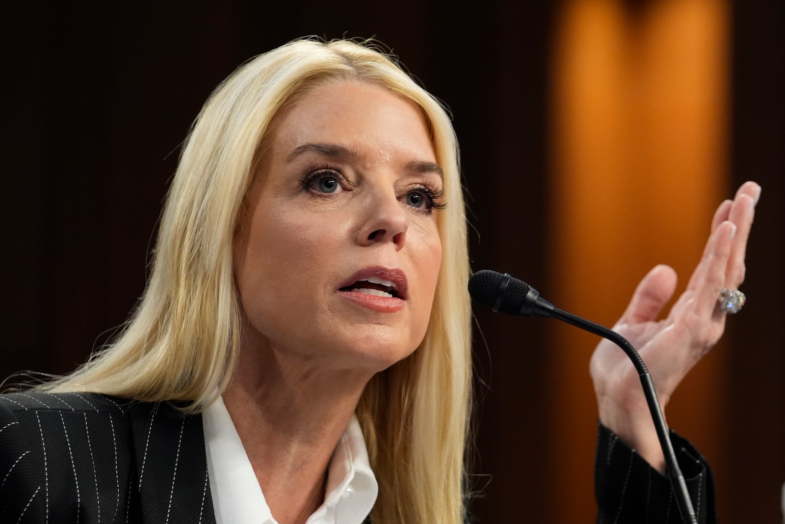 Pam Bondi, President-elect Donald Trump's choice to lead the Justice Department as attorney general, appears before the Senate Judiciary Committee for her confirmation hearing, at the Capitol in Washington, Wednesday, Jan. 15, 2025. (AP Photo/J. Scott Applewhite)