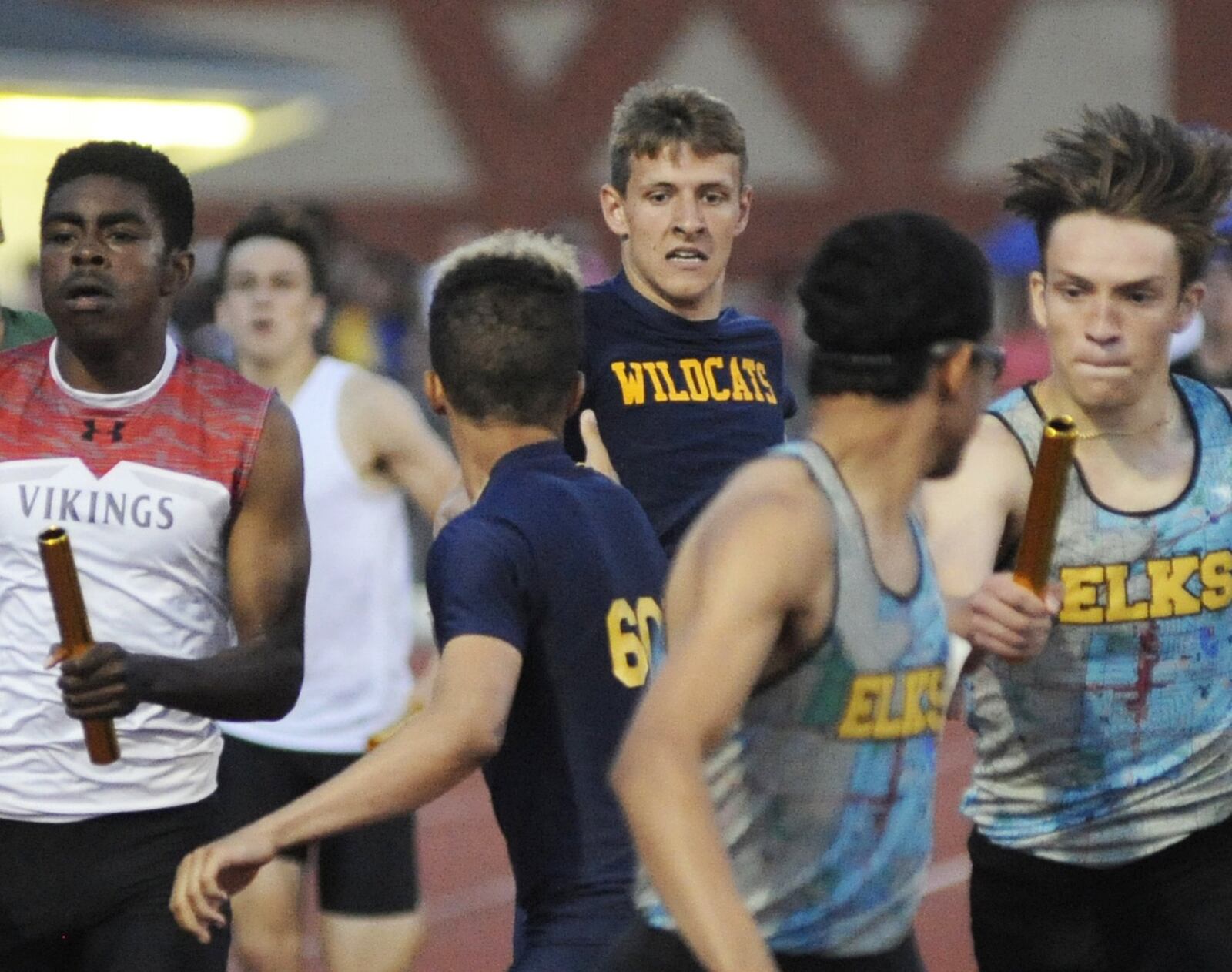 Springfield senior Dane Klosterman (middle) hands off to sophomore anchor Cameron Elliott in the 1,600-meter relay during the D-I regional track and field meet at Wayne High School on Friday, May 24, 2019. MARC PENDLETON / STAFF